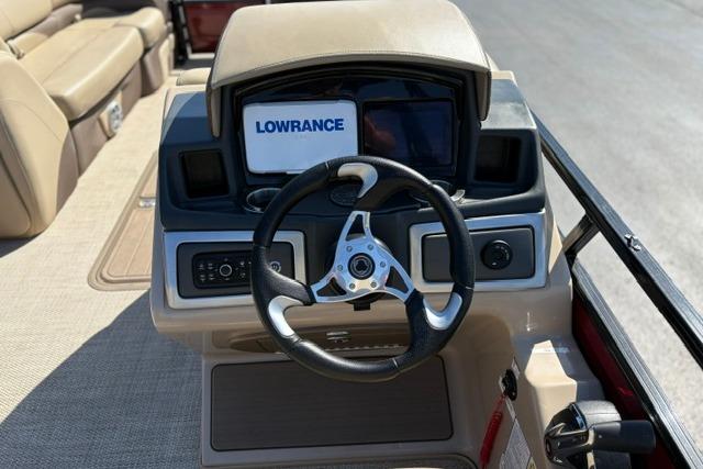 Steering console of 2025 Regency 250 DL3 boat with Lowrance navigation system.
