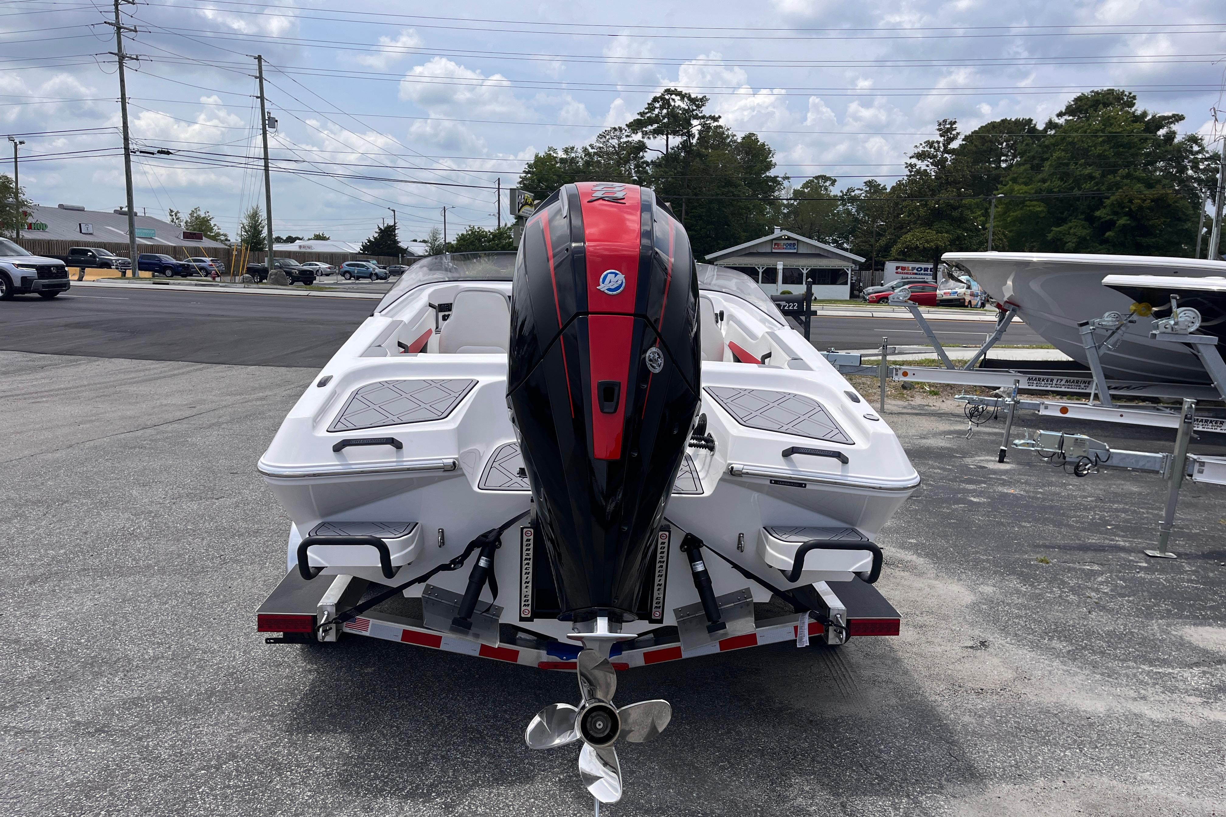 Checkmate Pulsare 2400 BRX 2025 on a trailer, rear view.