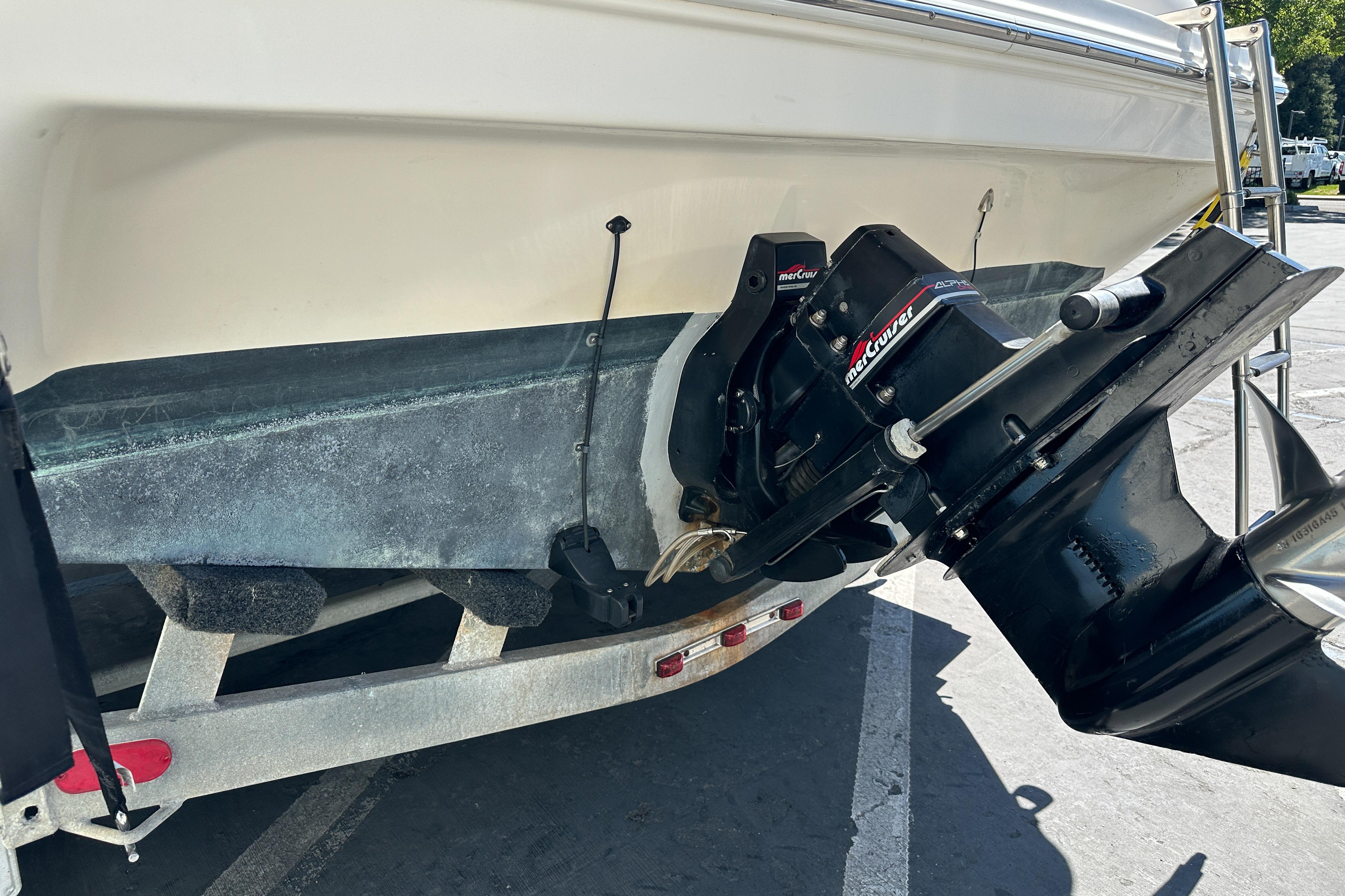 1998 Sea Ray 215 Express Cruiser boat on trailer, featuring MerCruiser outdrive.
