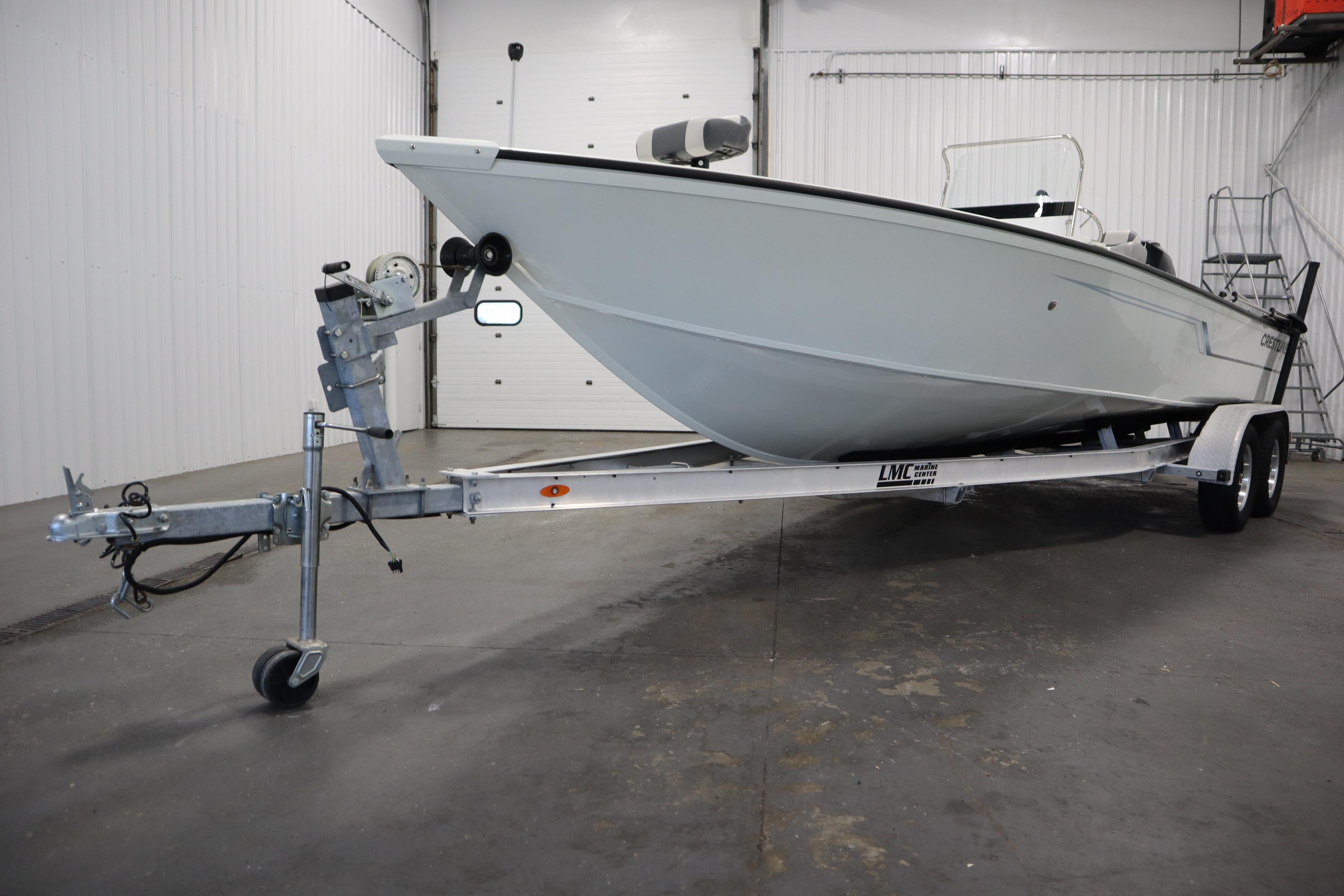 2022 Crestliner 2200 CC boat on trailer in indoor storage facility.