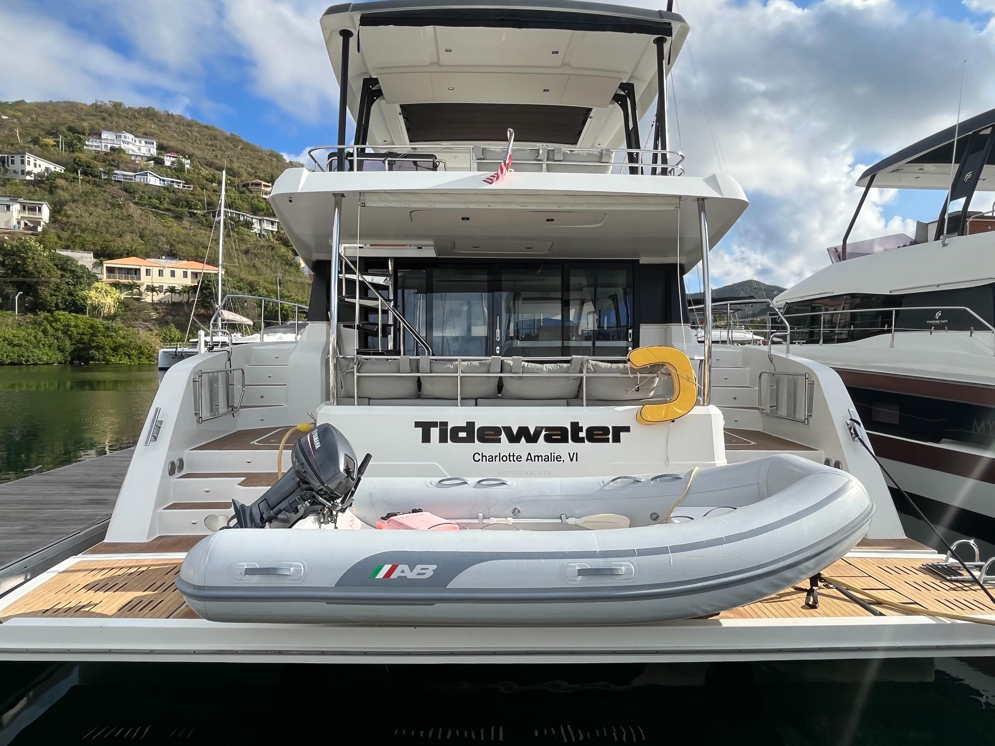 2020 Fountaine Pajot MY 44 yacht docked with inflatable boat on deck.