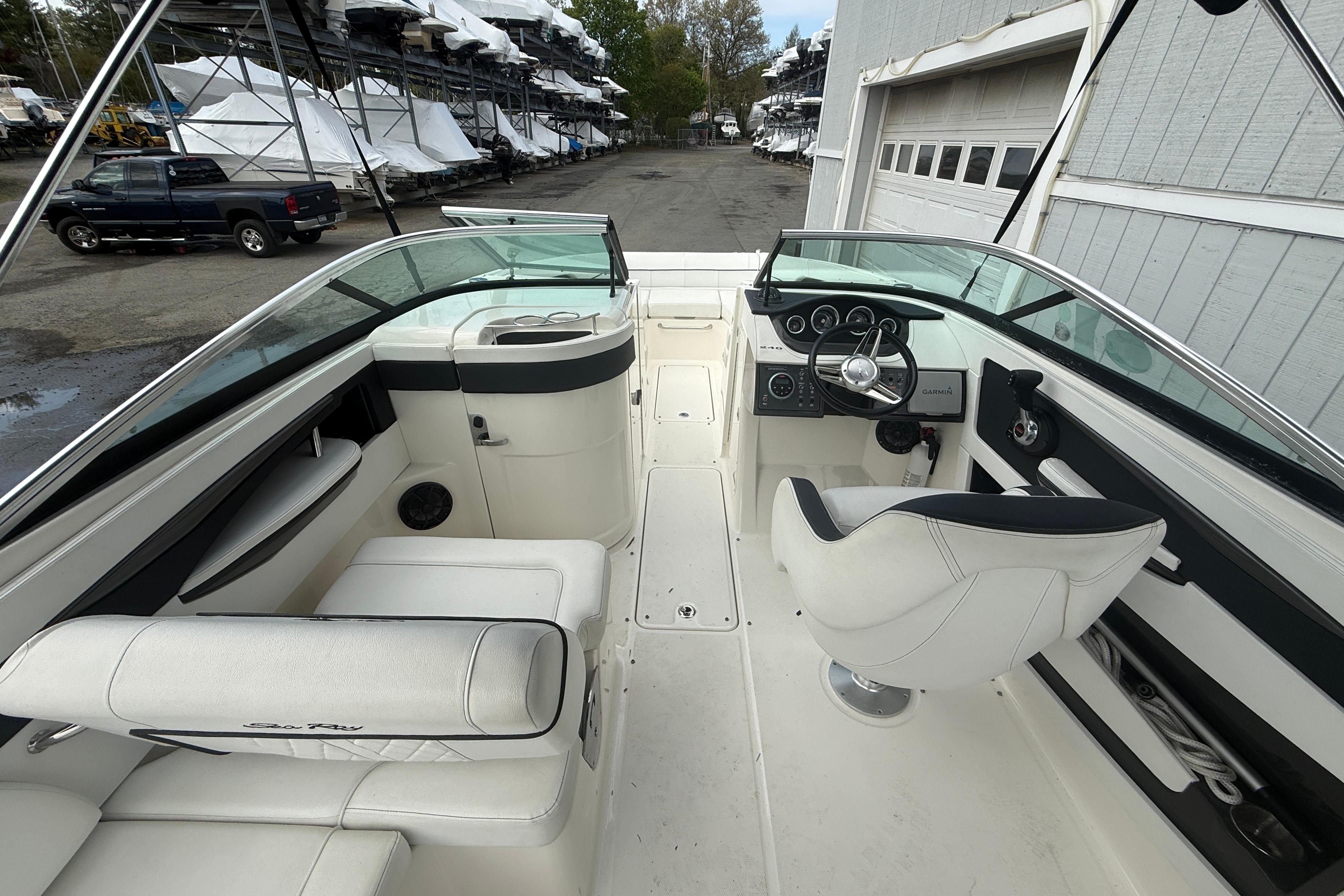 2015 Sea Ray 240 Sundeck boat interior with steering wheel and seating.
