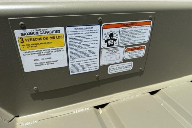 2026 Tracker Grizzly 12 Jon boat capacity and safety warning labels.