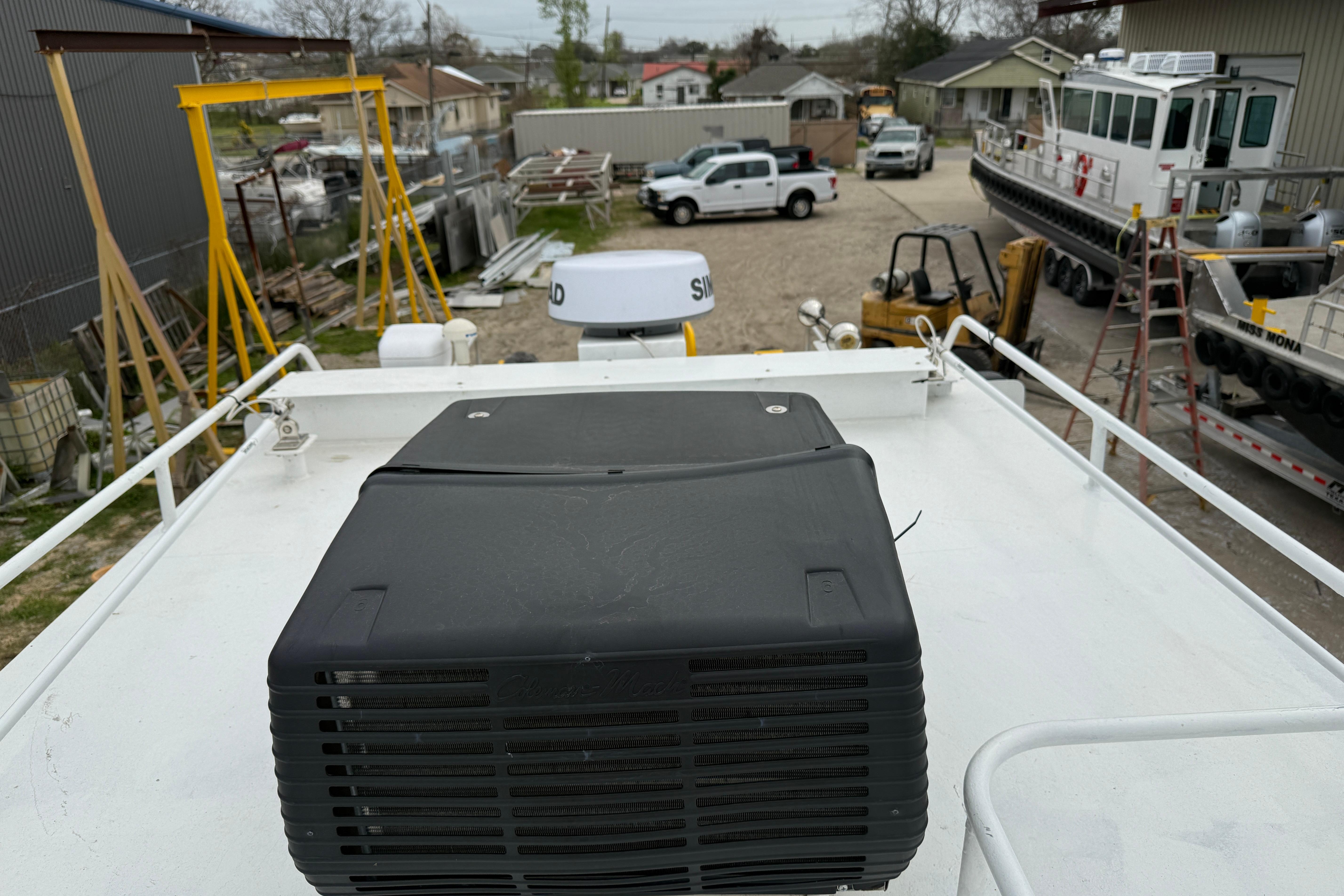 Rooftop view of a 2010 Custom Aluminum Work Boat, model 34x10, in a shipyard.