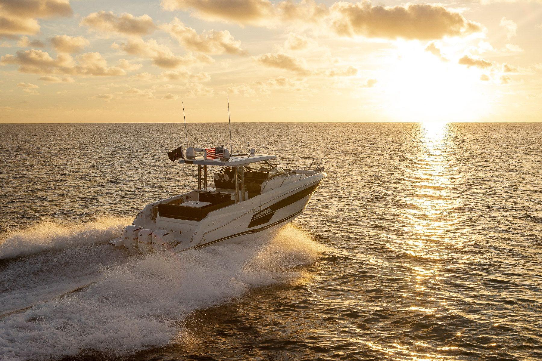 2026 Jeanneau Leader 12.5 WA cruising at sunset on open sea.