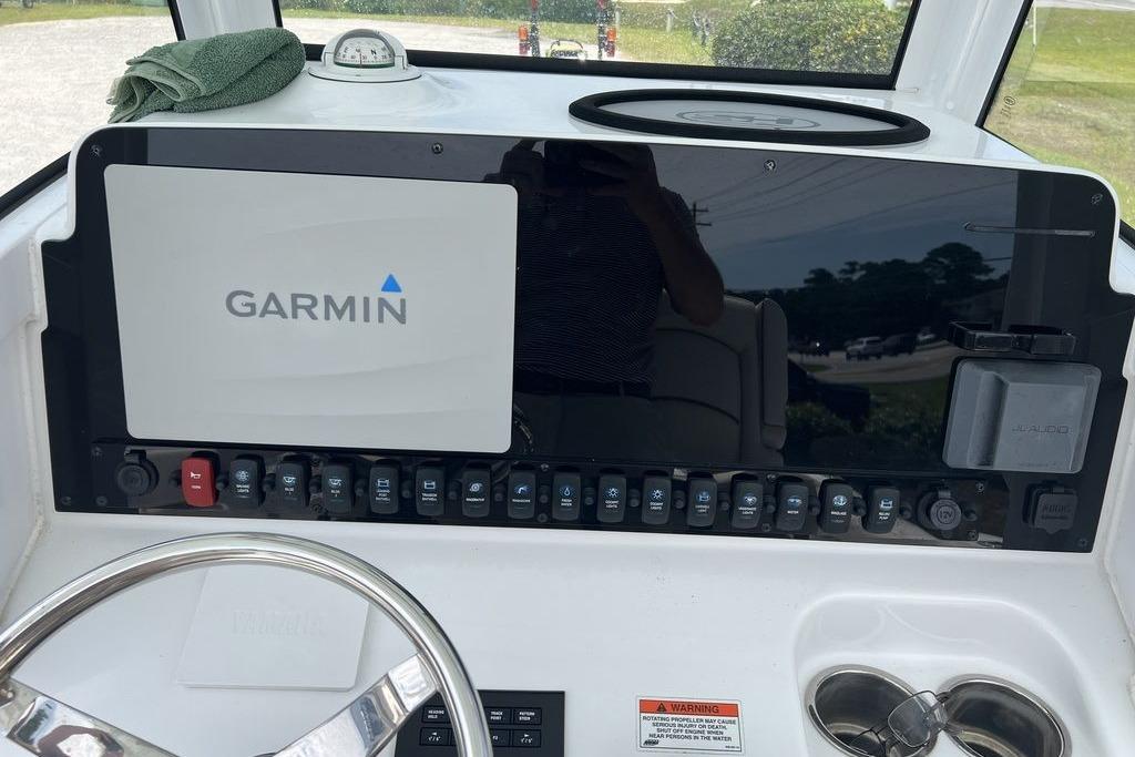 2021 Sea Hunt Gamefish 25 dashboard with Garmin navigation system and control panel.