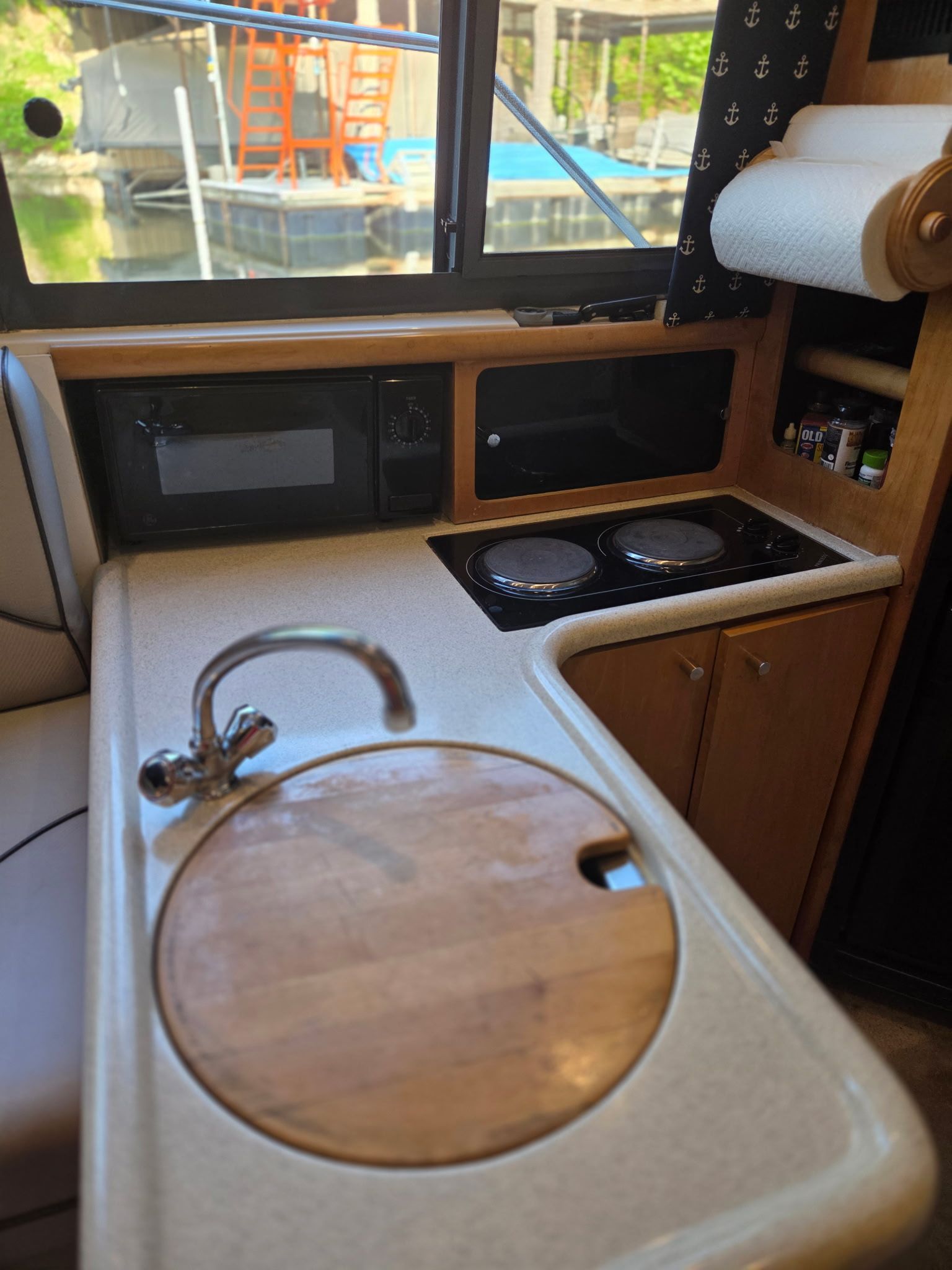 Interior of the 1996 Carver Voyager with kitchenette and stove.