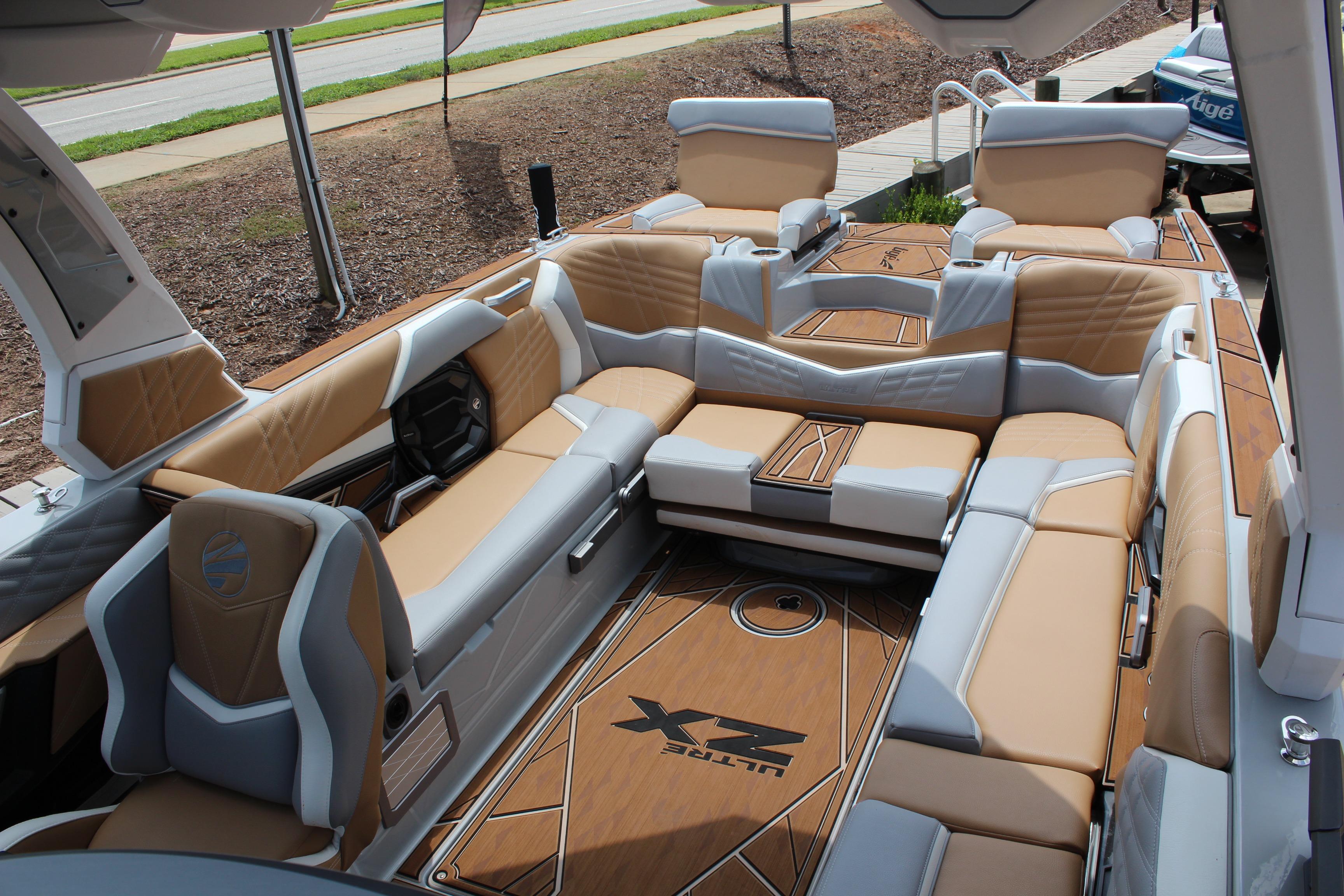 2024 Tigé Ultré 25ZX boat interior with luxurious tan and gray seating.