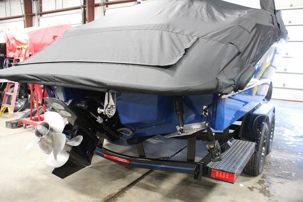 2025 Cobalt R6 boat on trailer, covered, in indoor storage facility.