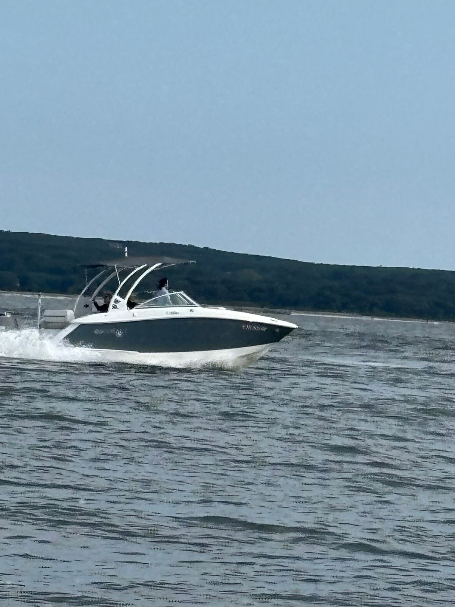 2020 Cobalt SC23 boat cruising on a lake.
