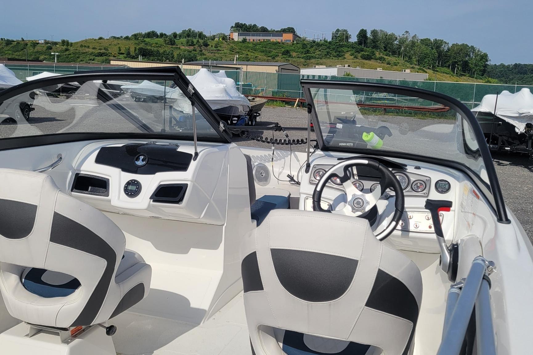 2024 Tahoe 200 S boat interior with steering wheel and dashboard controls.