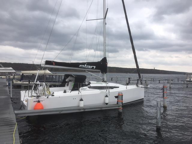 2020 Elan E3 sailboat docked on a cloudy day at a marina.
