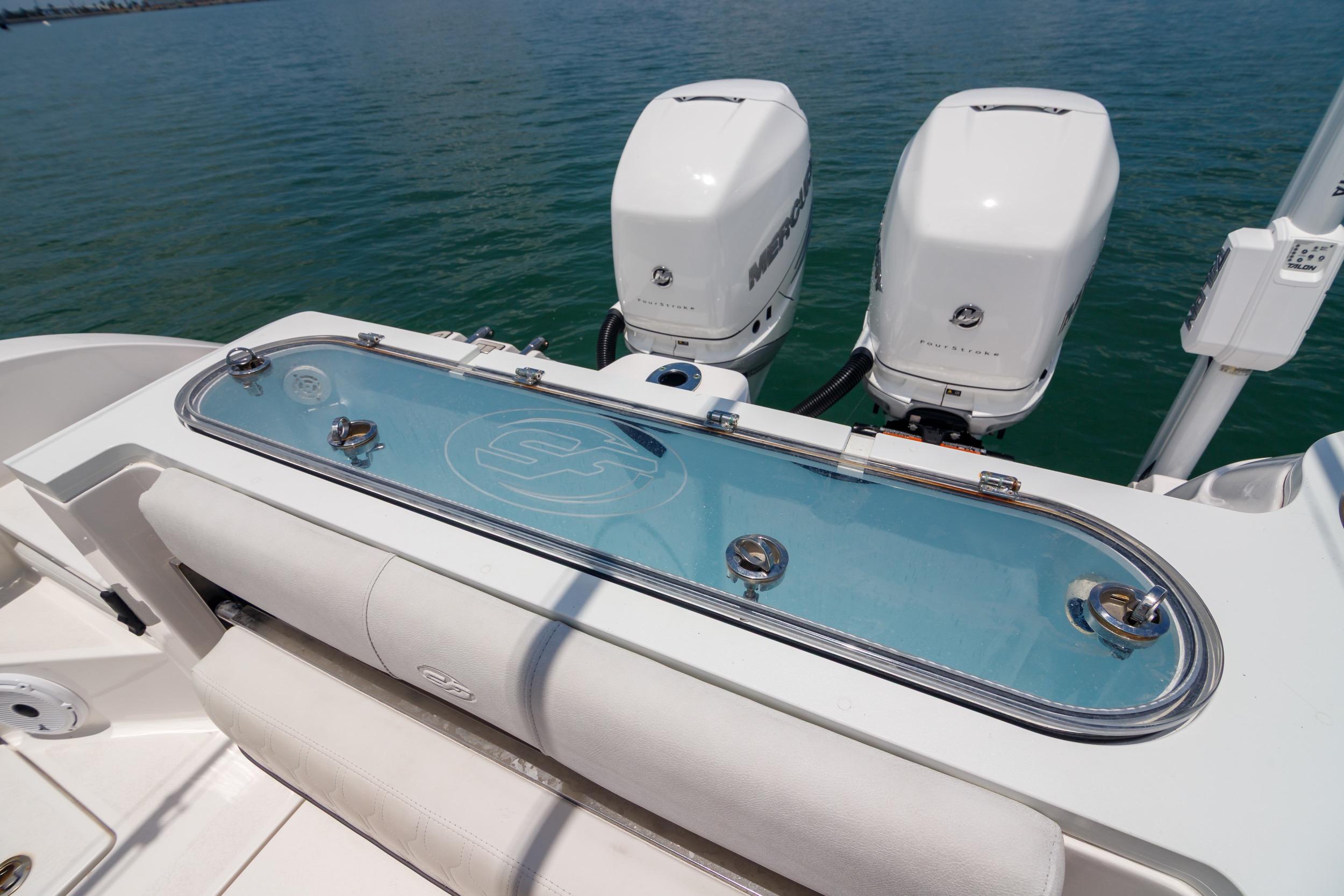 Sea Fox 328 Commander 2021 boat with dual outboard engines and livewell on deck.