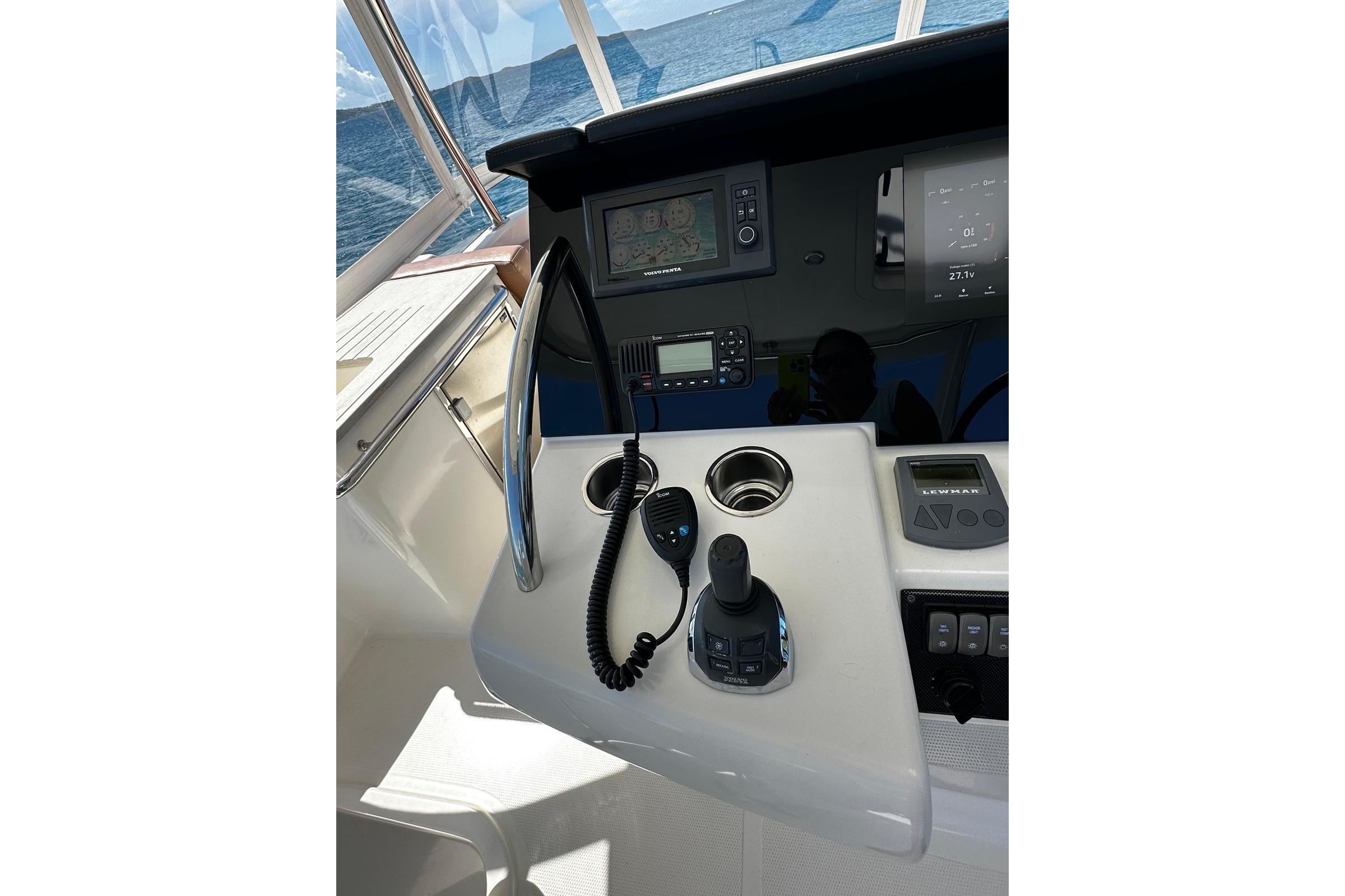 Control panel of 2012 Riviera 43 Flybridge yacht with navigation equipment.