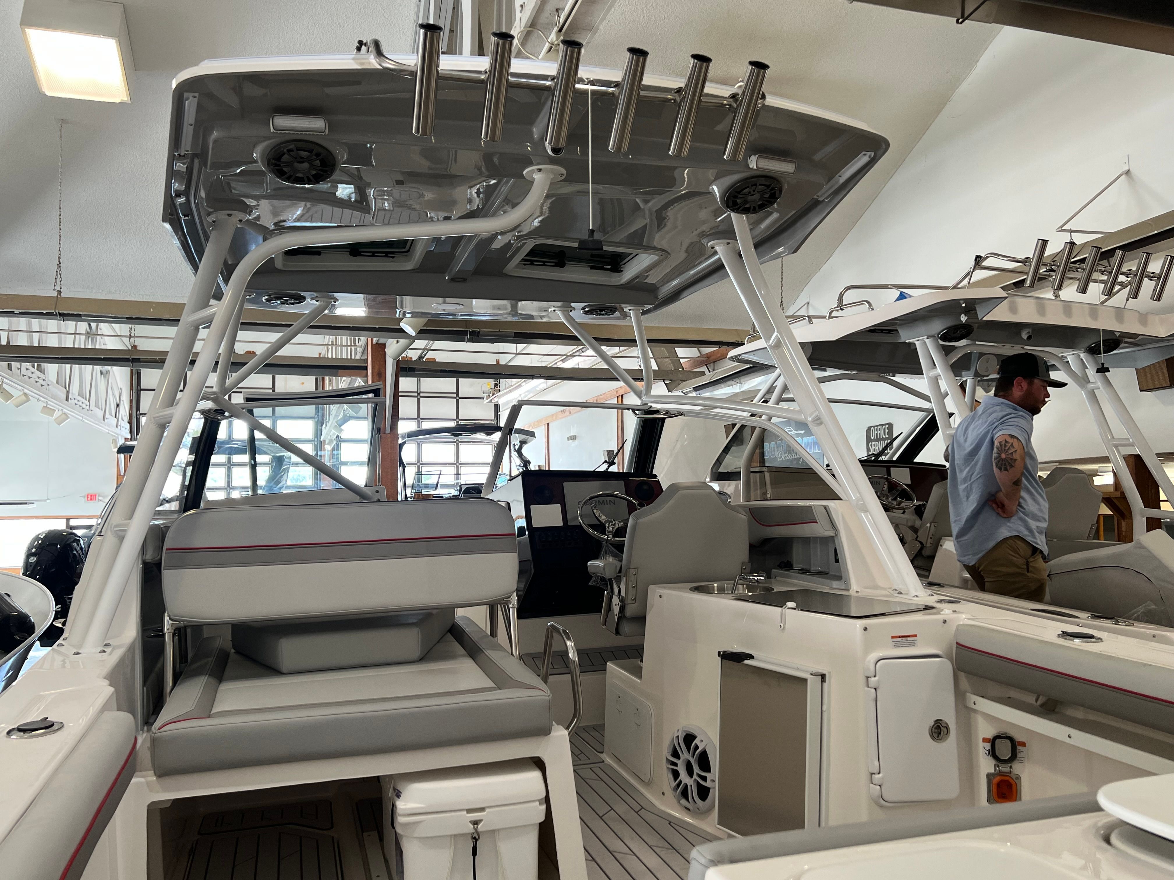 Interior view of 2023 Solara S 250DC boat in showroom.