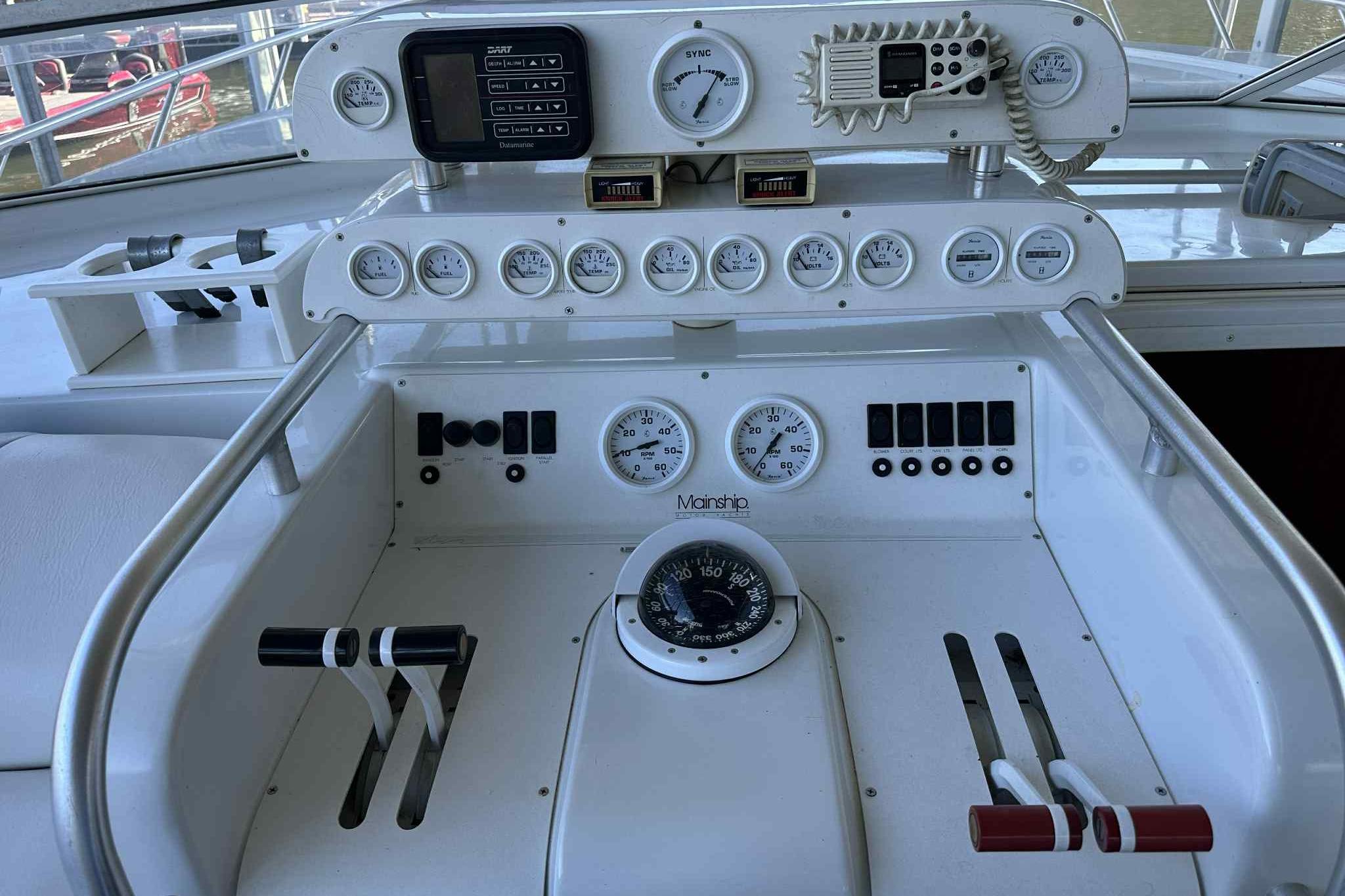 1993 Mainship 39 Express boat dashboard with gauges, controls, and navigation instruments.