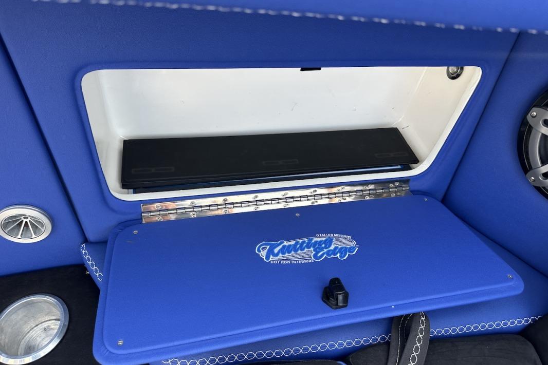 Blue interior compartment of 2018 Wright Performance 420 boat with custom upholstery.