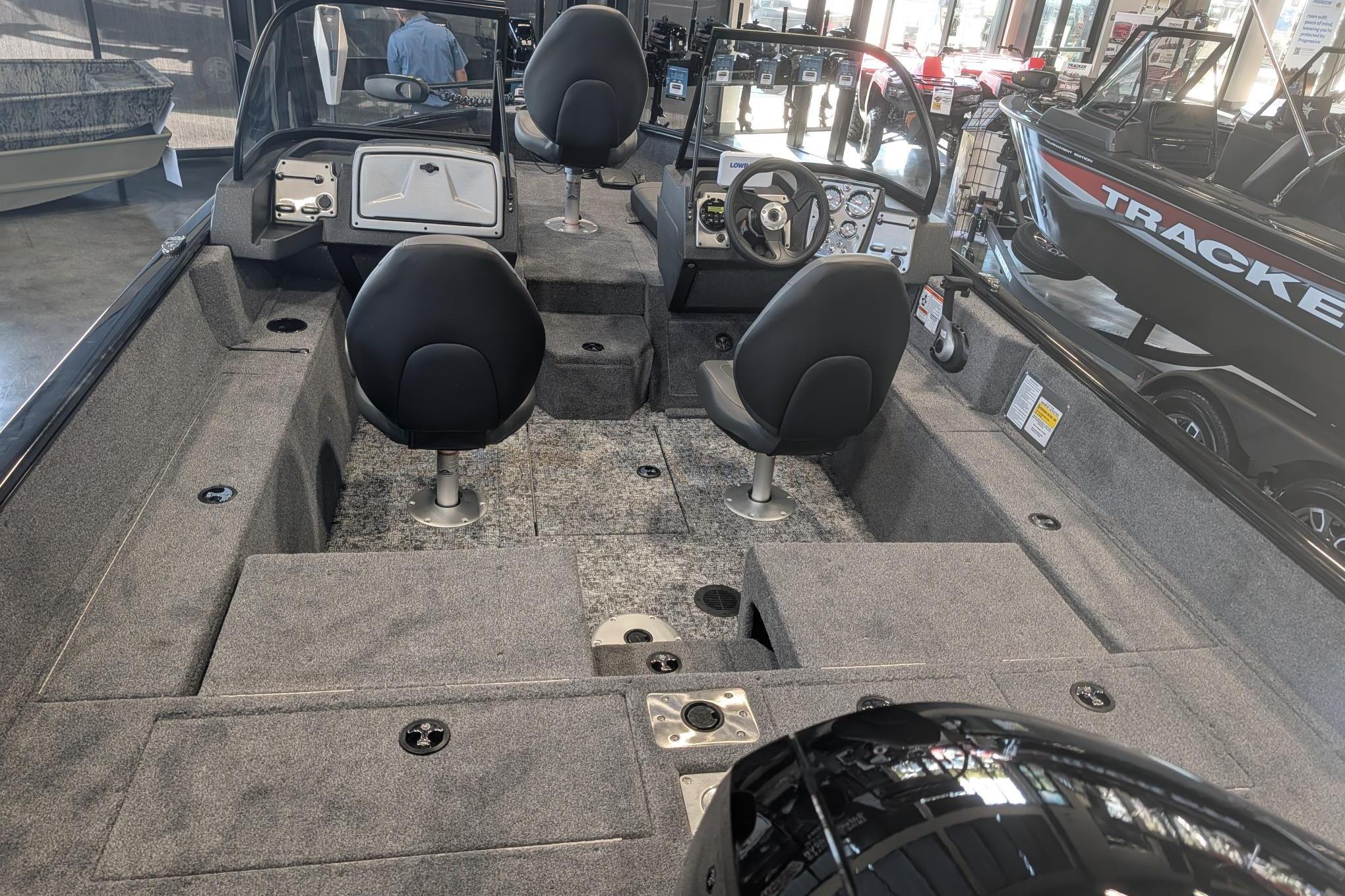 2026 Tracker Pro Guide V-175 Combo boat interior with seating and steering console.