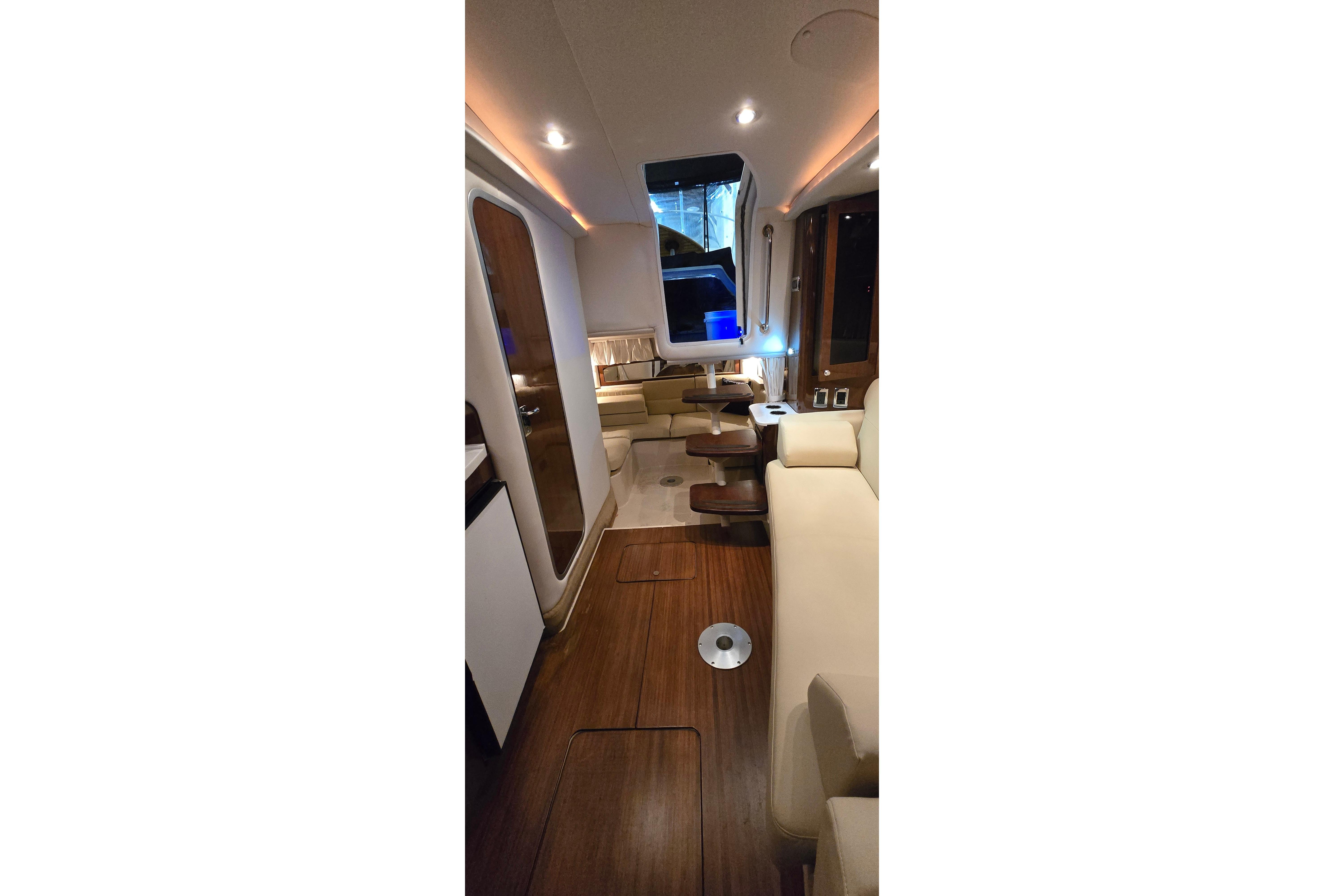 Interior of 2018 Four Winns V355 yacht with elegant seating and modern design.