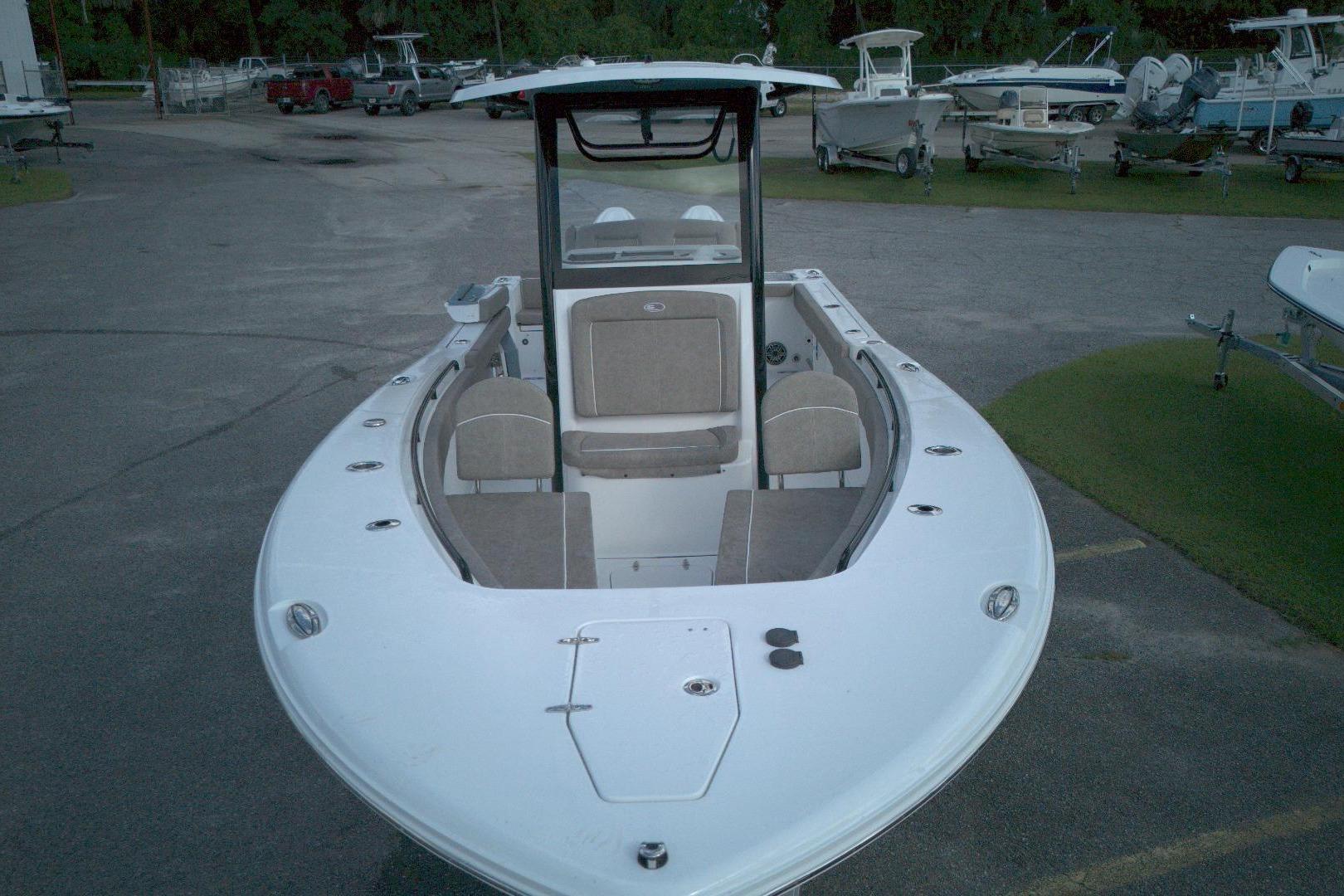 2026 Sea Hunt Gamefish 25 boat, front view, parked in a marina.