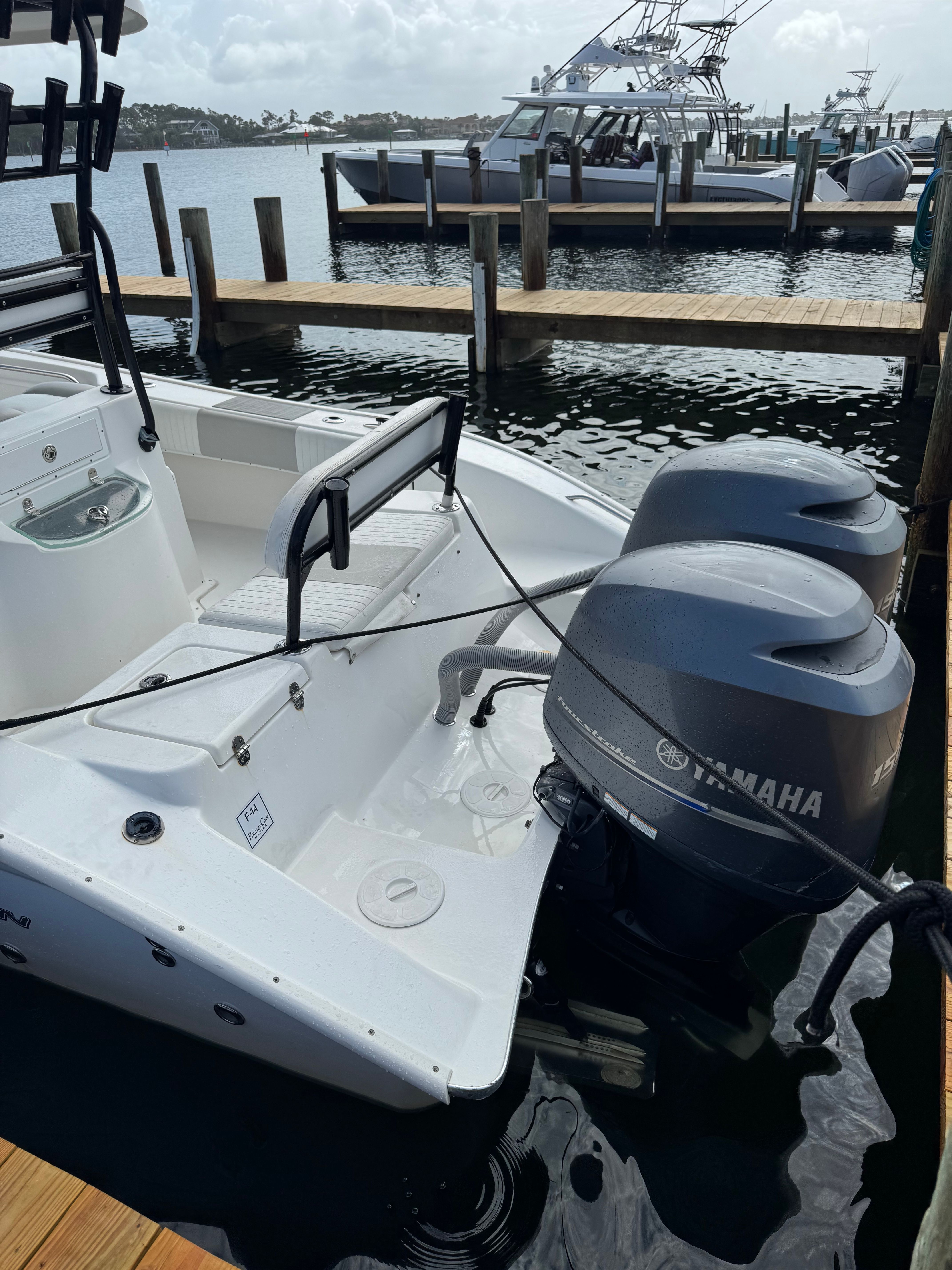 A 2014 Cape Horn 24XS boat with twin Yamaha outboard engines at the dock.