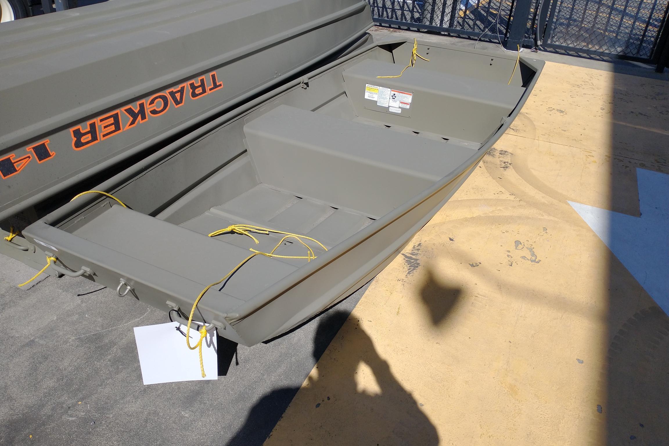 2026 Tracker Grizzly 12 Jon boat displayed outdoors, featuring durable construction and simple design.