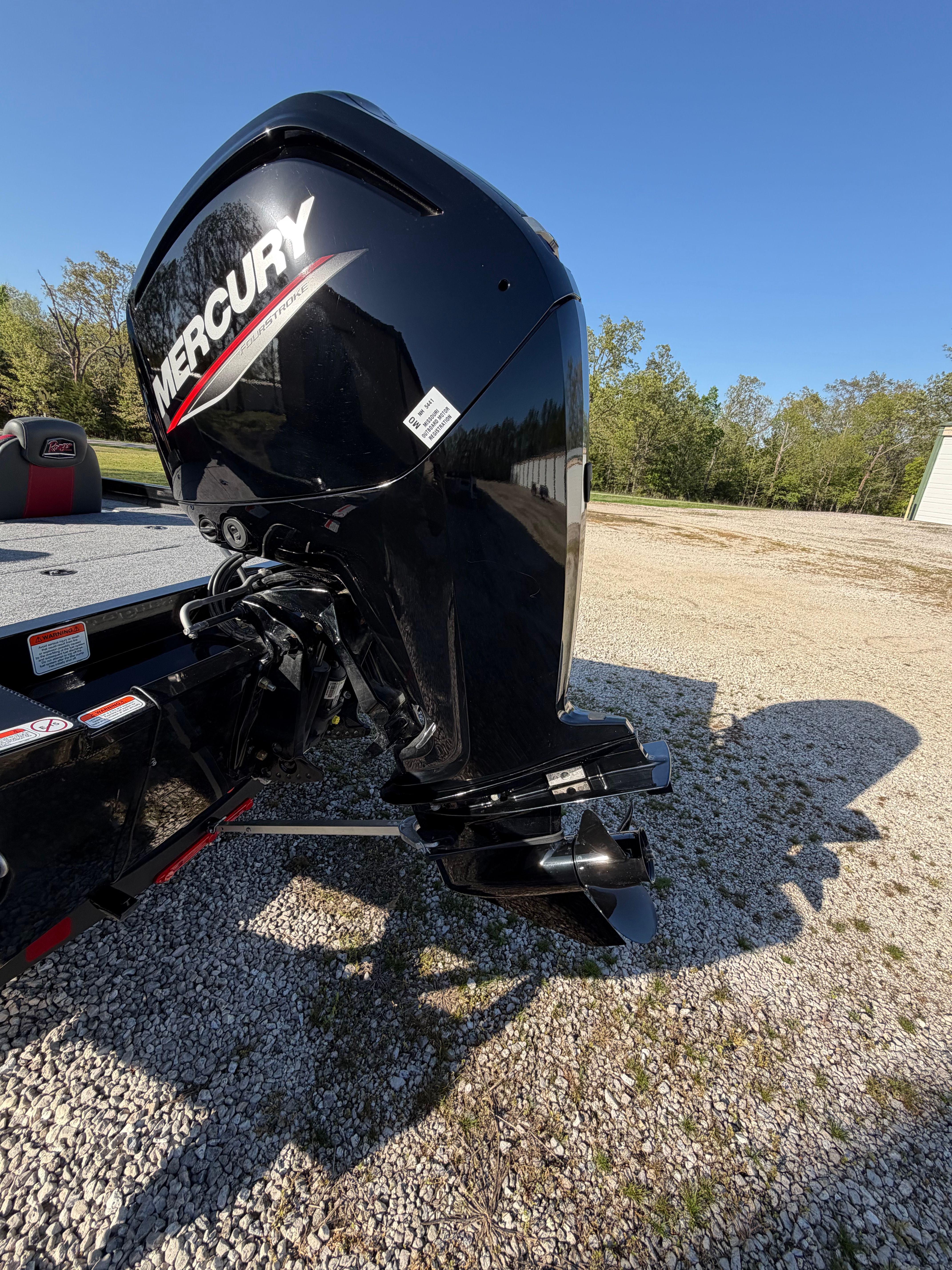 2024 Ranger RT188 with Mercury outboard motor on gravel surface.