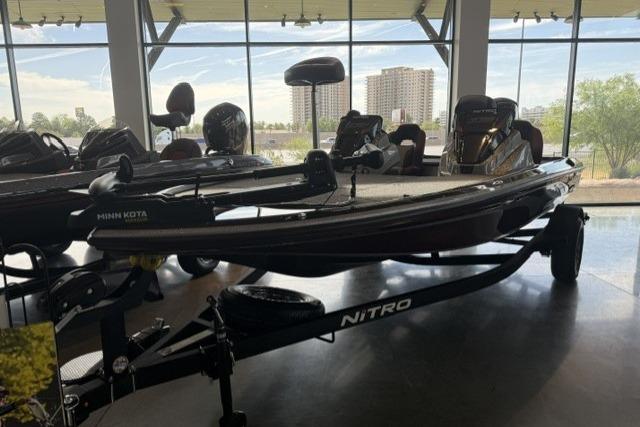 2026 Nitro Z18 boat displayed indoors with cityscape view.
