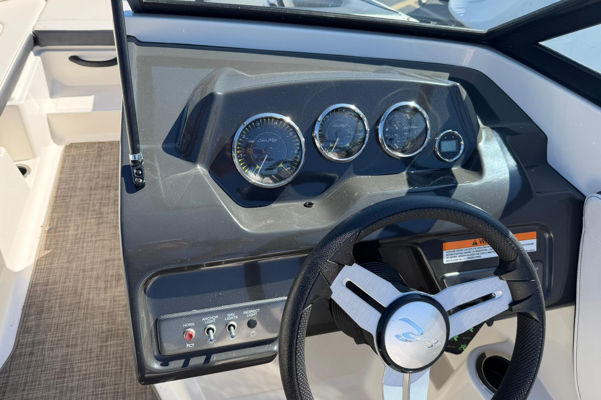 2016 Sea Ray SPX 210 dashboard with steering wheel and instrument panel.