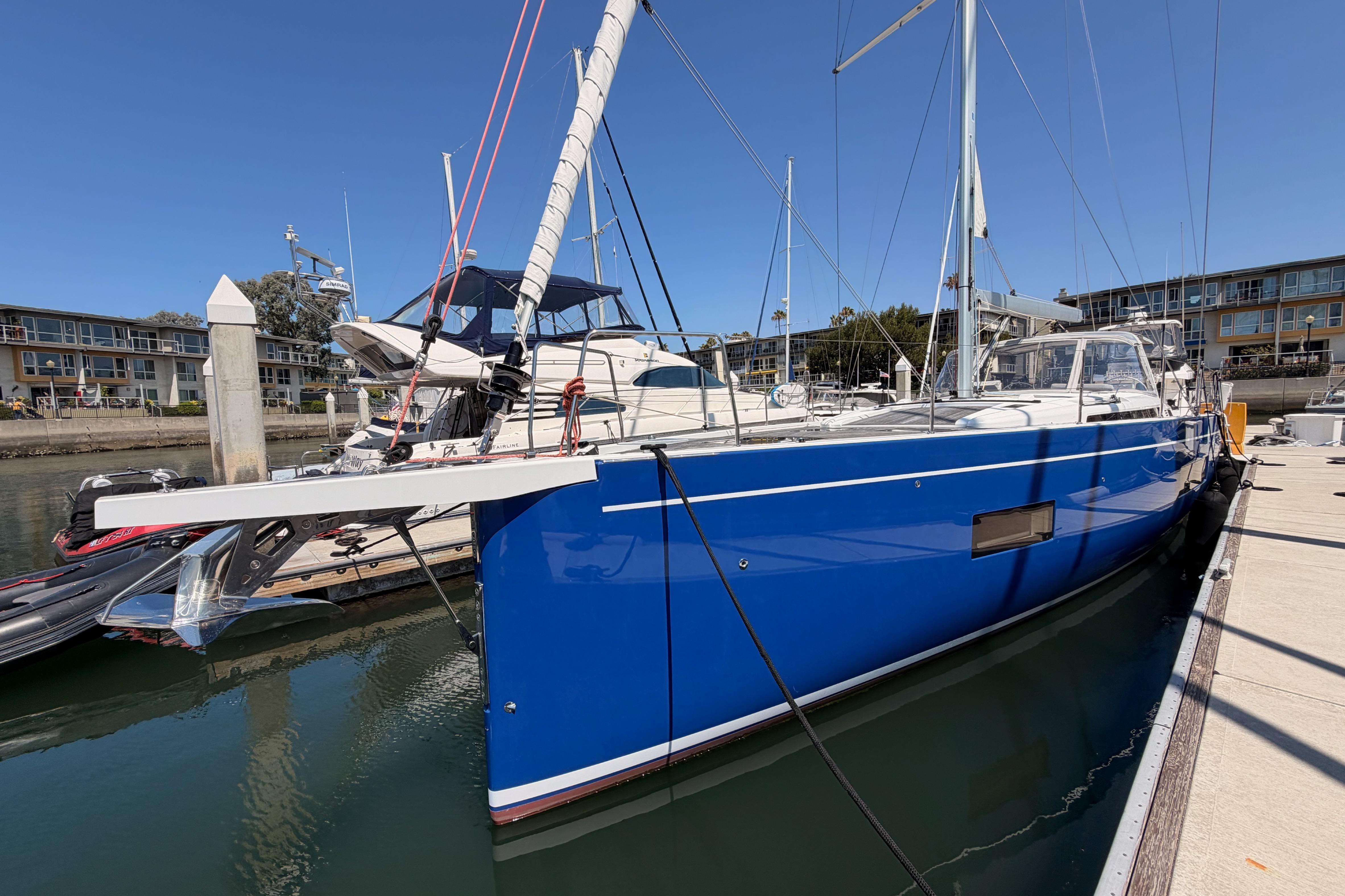 2022 Beneteau Oceanis Yacht 54 docked, featuring sleek blue hull and modern design.