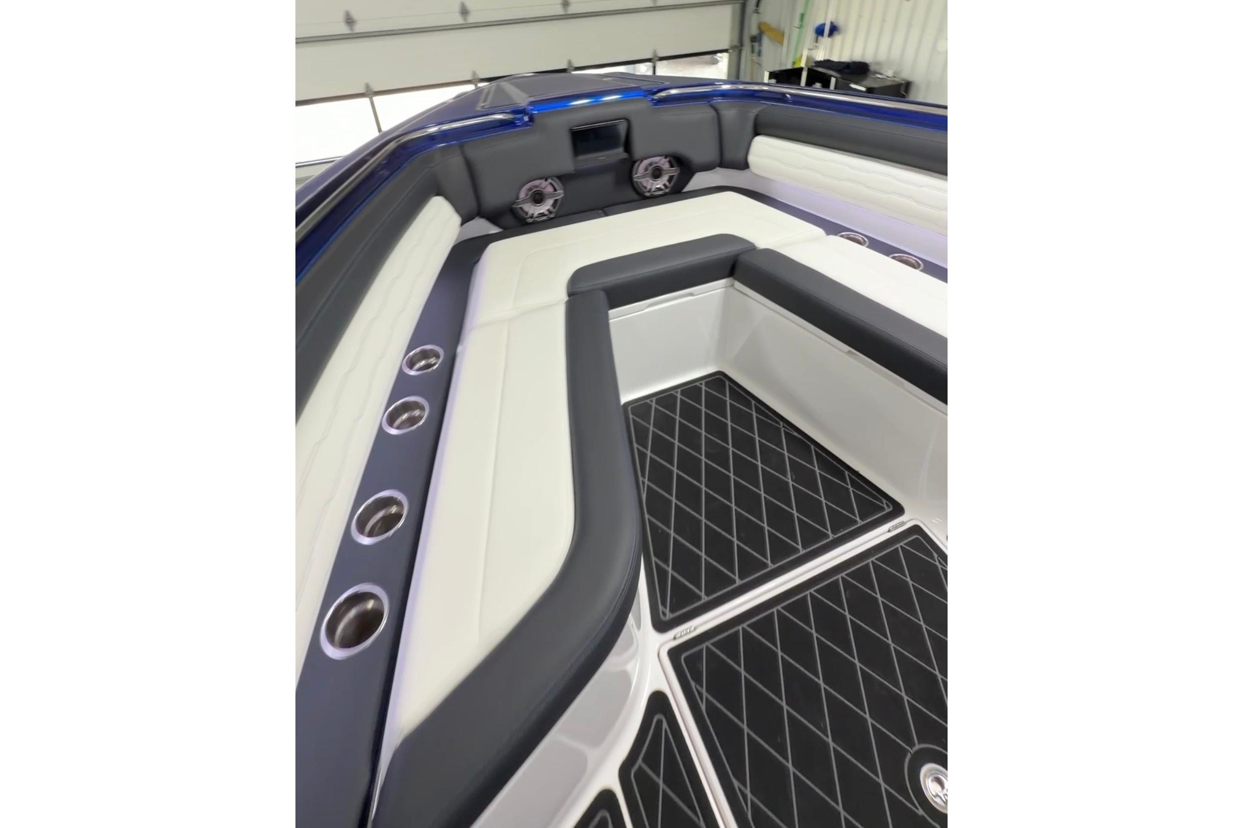 2024 Cigarette 41' Nighthawk boat interior with cushioned seating and sleek design.