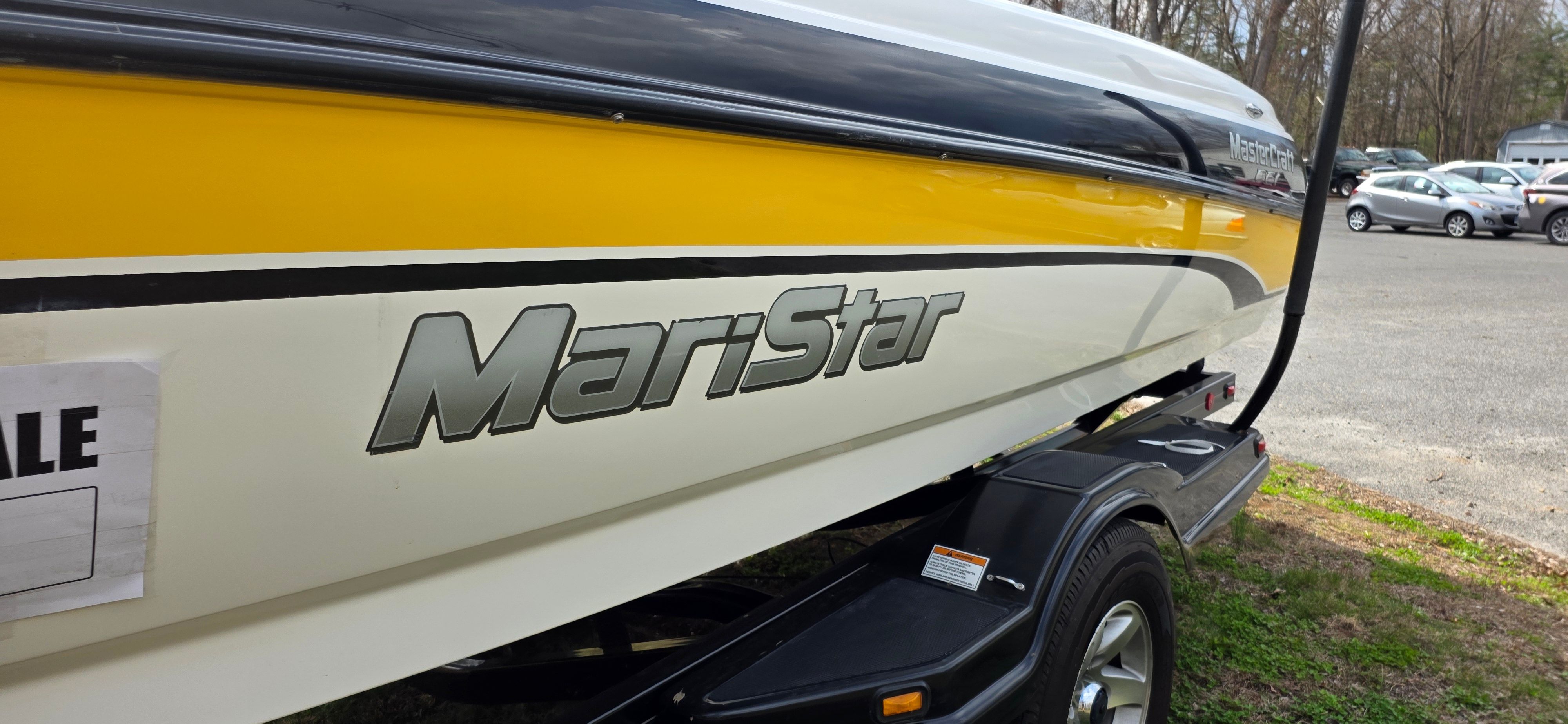 2004 MasterCraft Maristar boat, yellow and white, for sale.