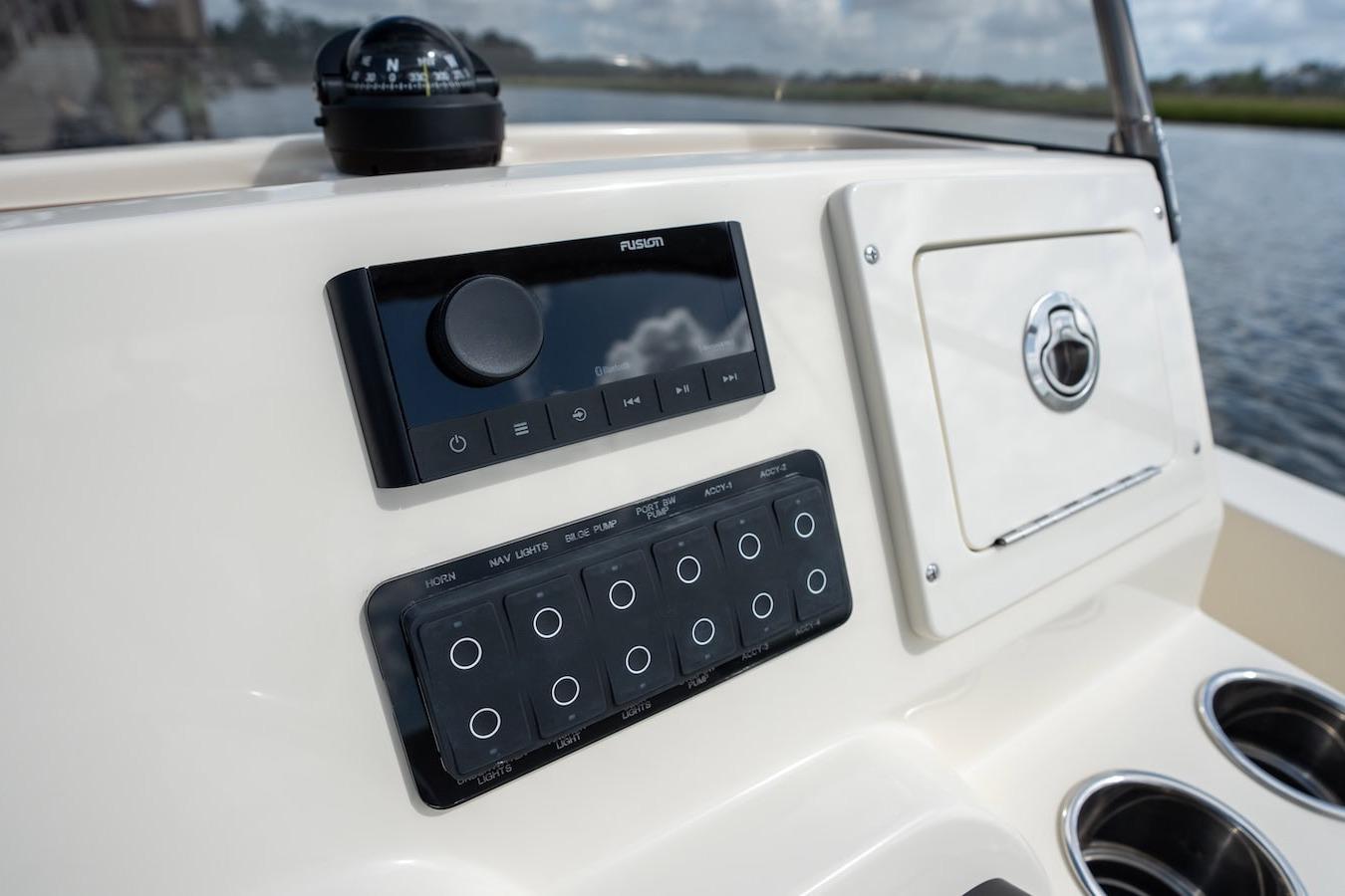 Control panel of 2026 Scout 188 Sportfish boat with navigation and audio system.