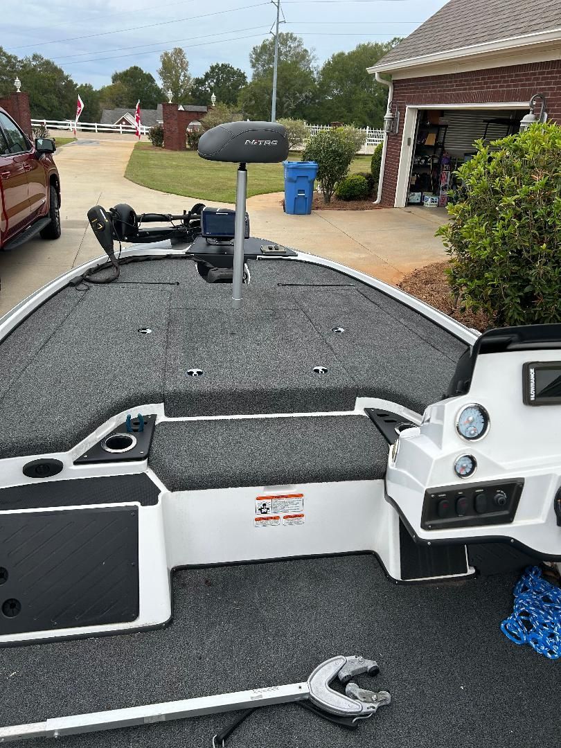 The image shows the deck of a 2020 Nitro Z18 boat with gray carpeting.