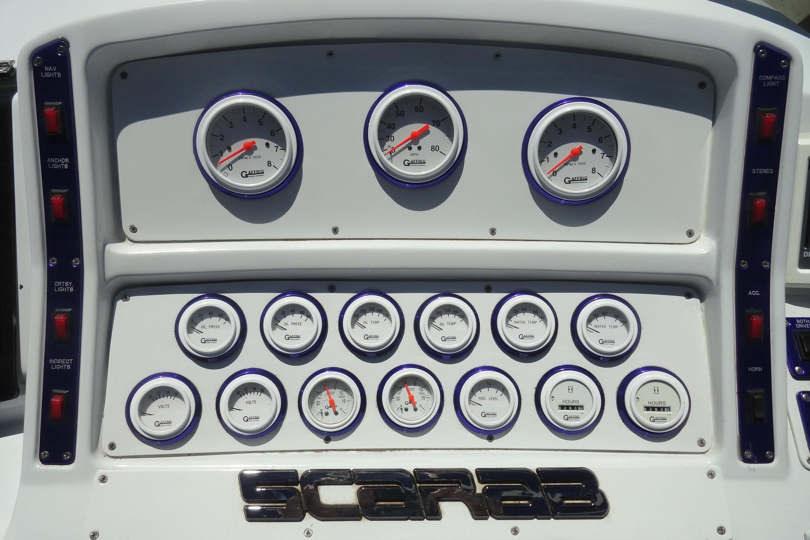 Dashboard of a 1988 Wellcraft 34 Scarab boat with multiple gauges and controls.
