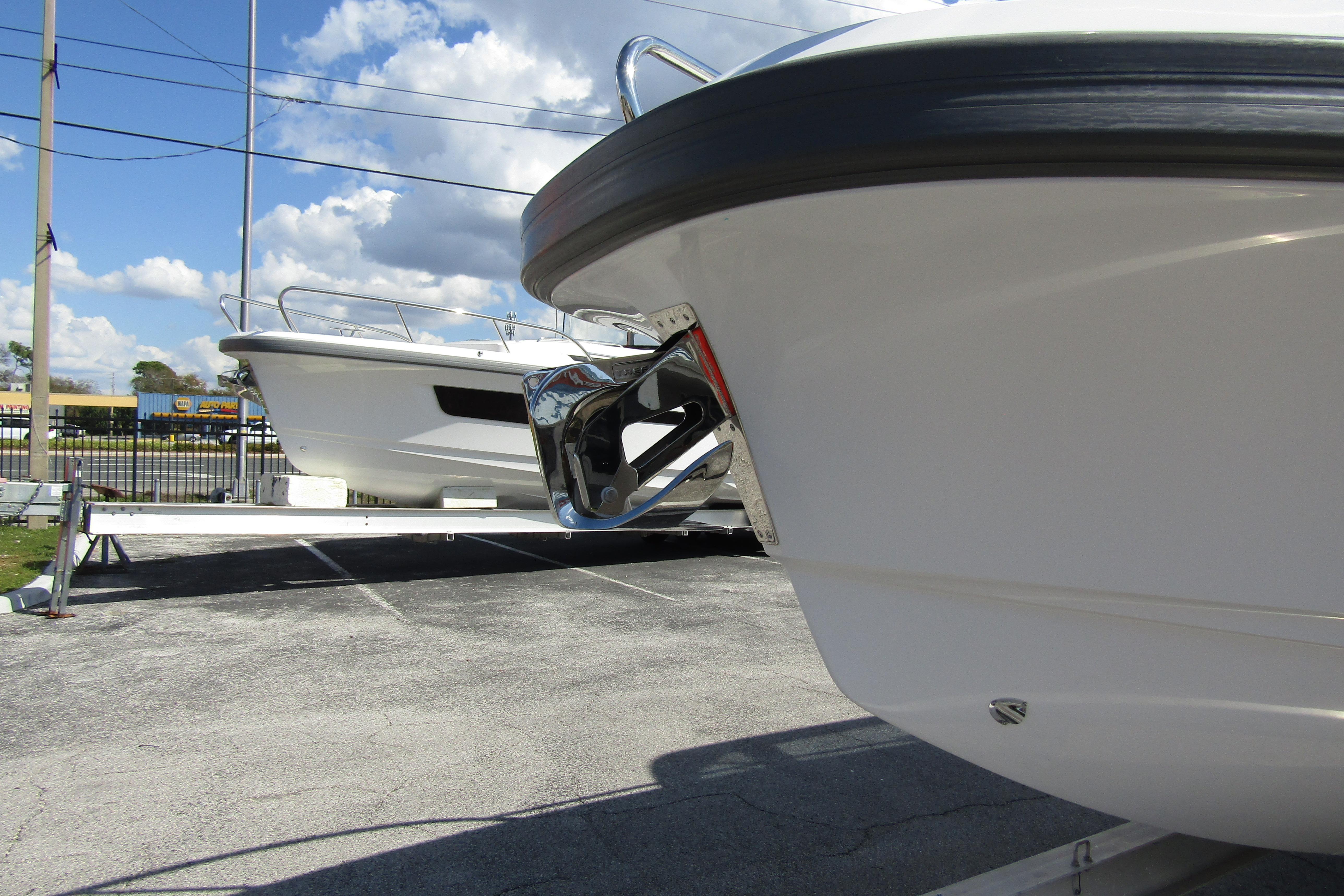 Front view of a 2026 Nimbus Tender 9 boat on a parking lot.