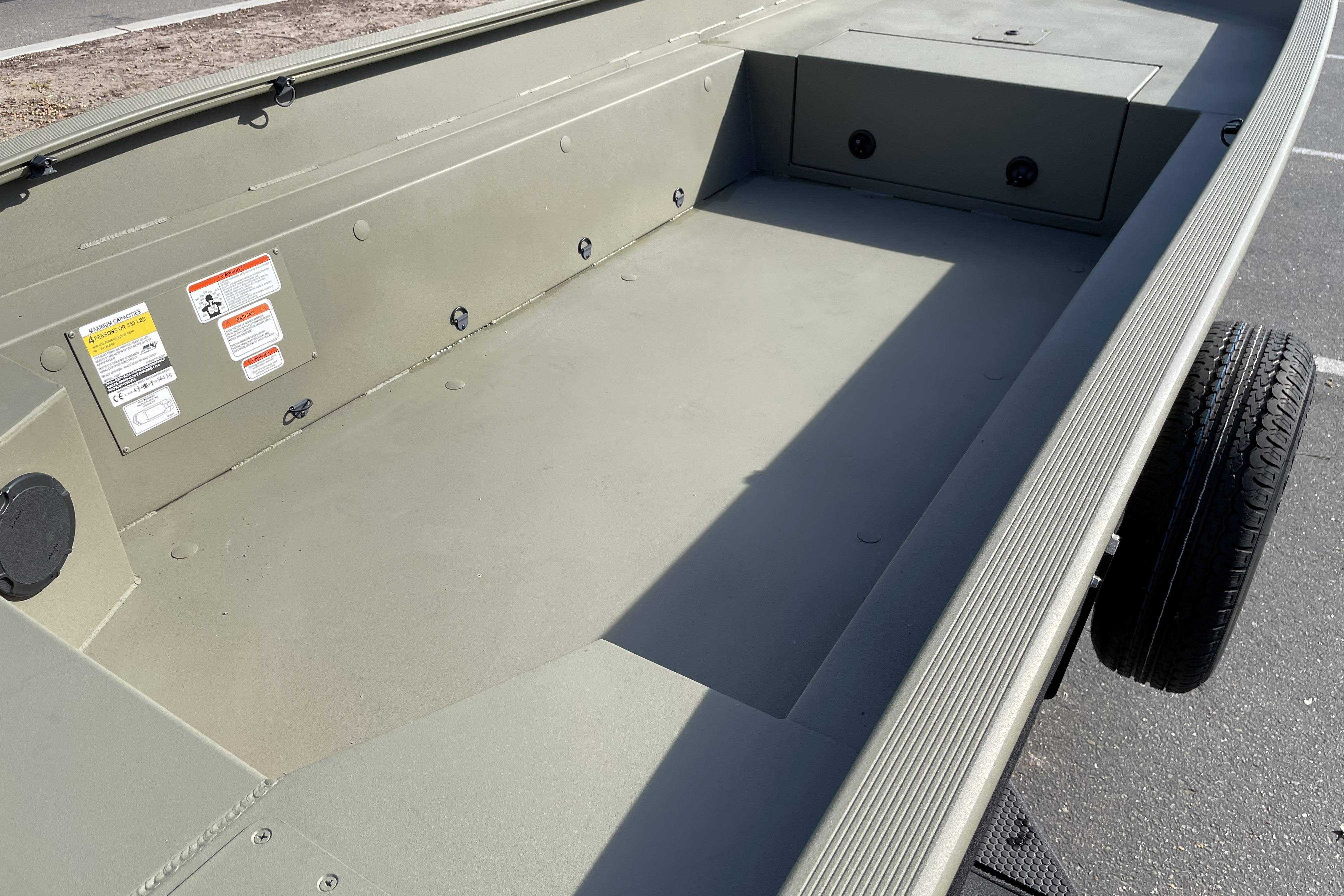 2026 Tracker Grizzly 1650 T Prairie Wings Edition boat interior, showcasing spacious deck and storage.