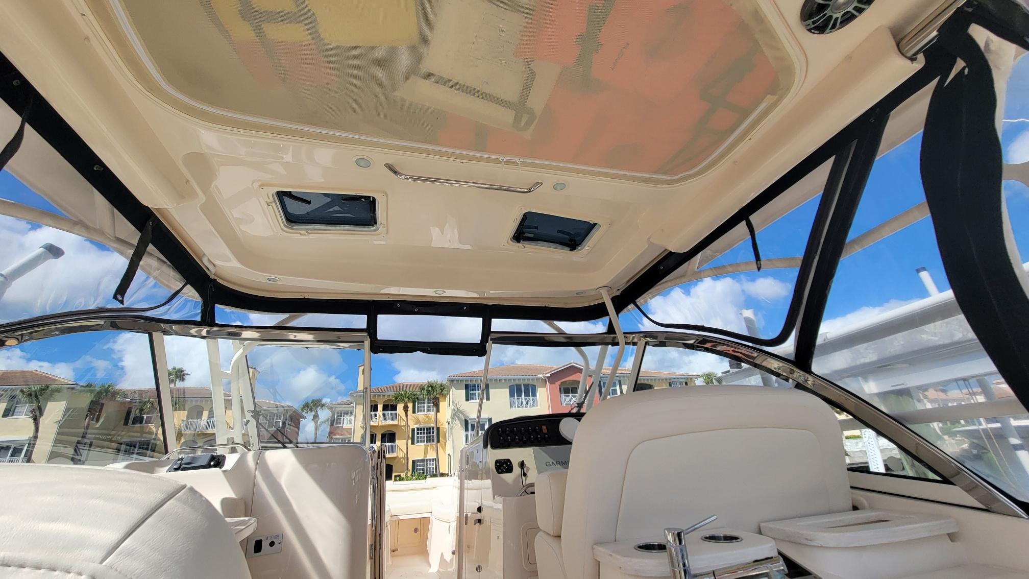 Interior view of 2021 Grady-White Freedom 335 boat with clear sky background.