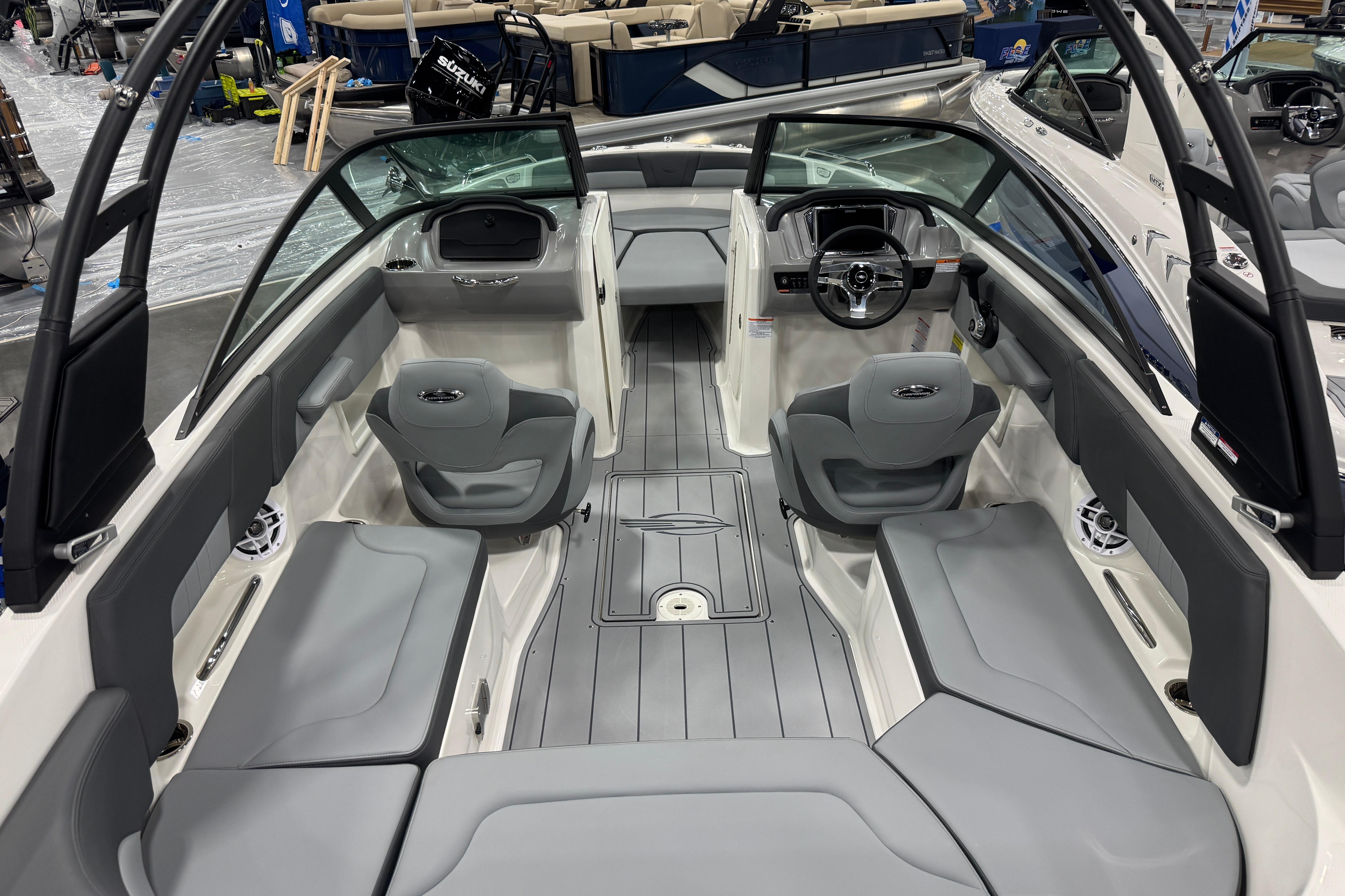 2026 Chaparral 23 SSi boat interior with sleek gray seating and modern dashboard design.