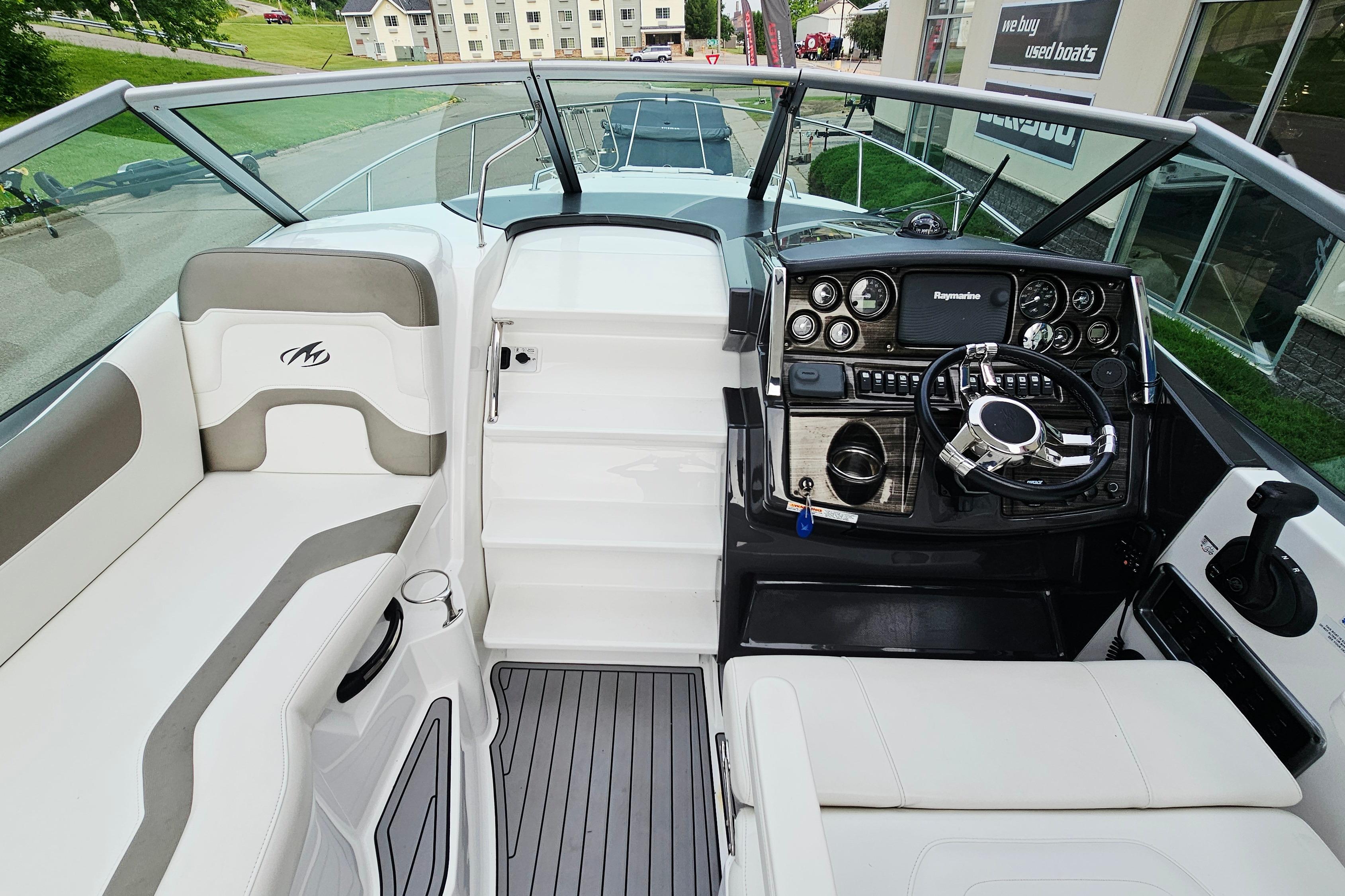 2016 Monterey 295 Sport Yacht cockpit with modern controls and comfortable seating.