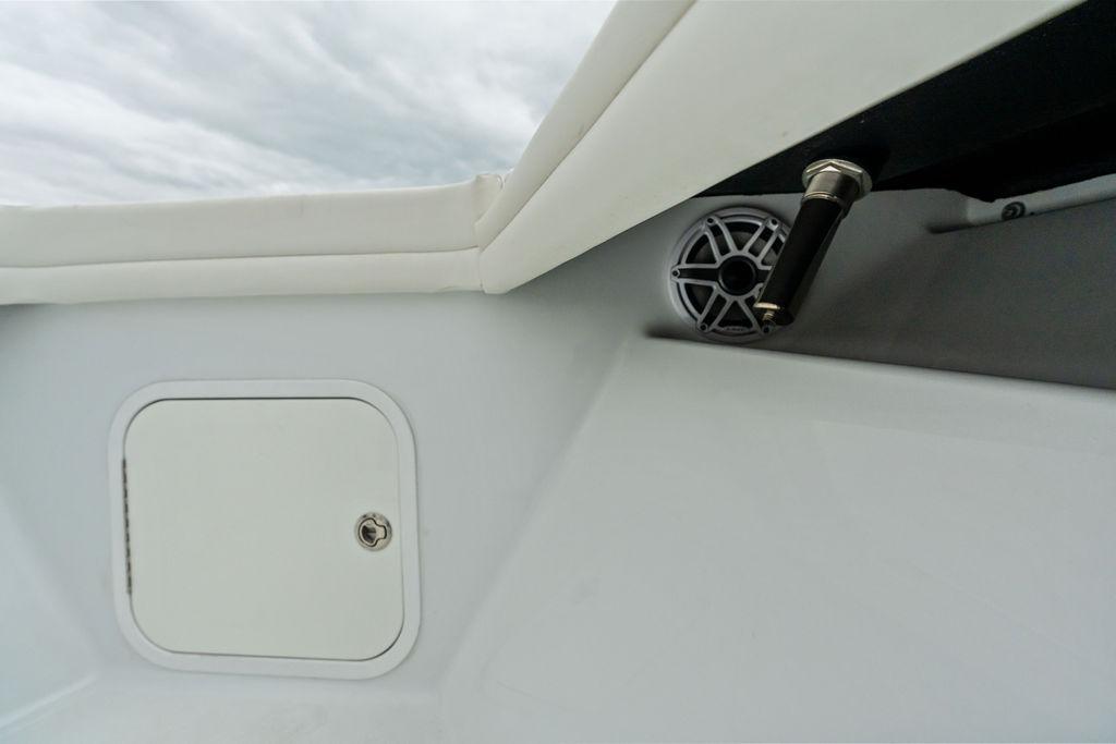2021 Yellowfin 36 Offshore boat interior with speaker and storage compartment.