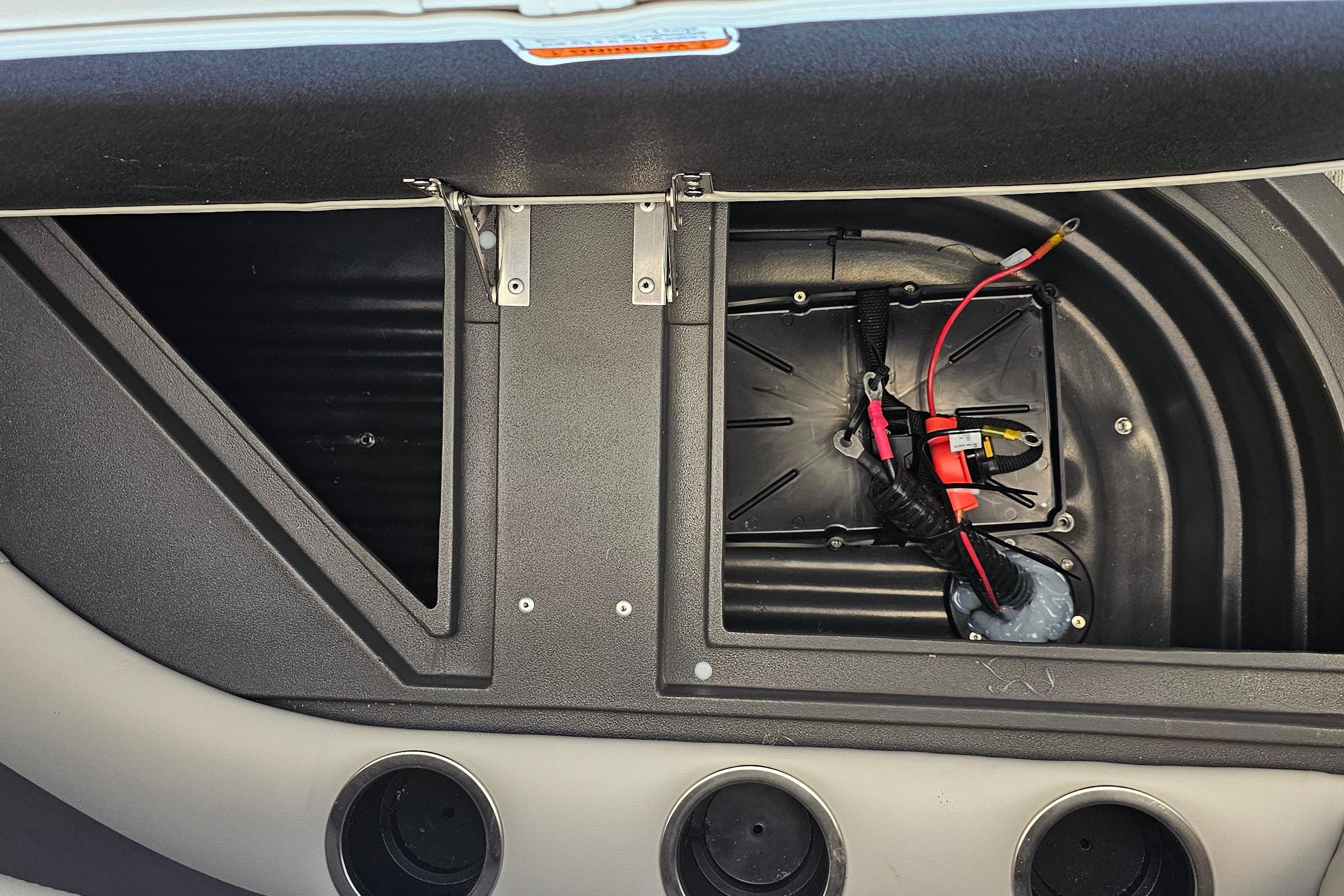 2026 Sun Tracker Bass Buggy 16 XL Select storage compartment with wiring details.
