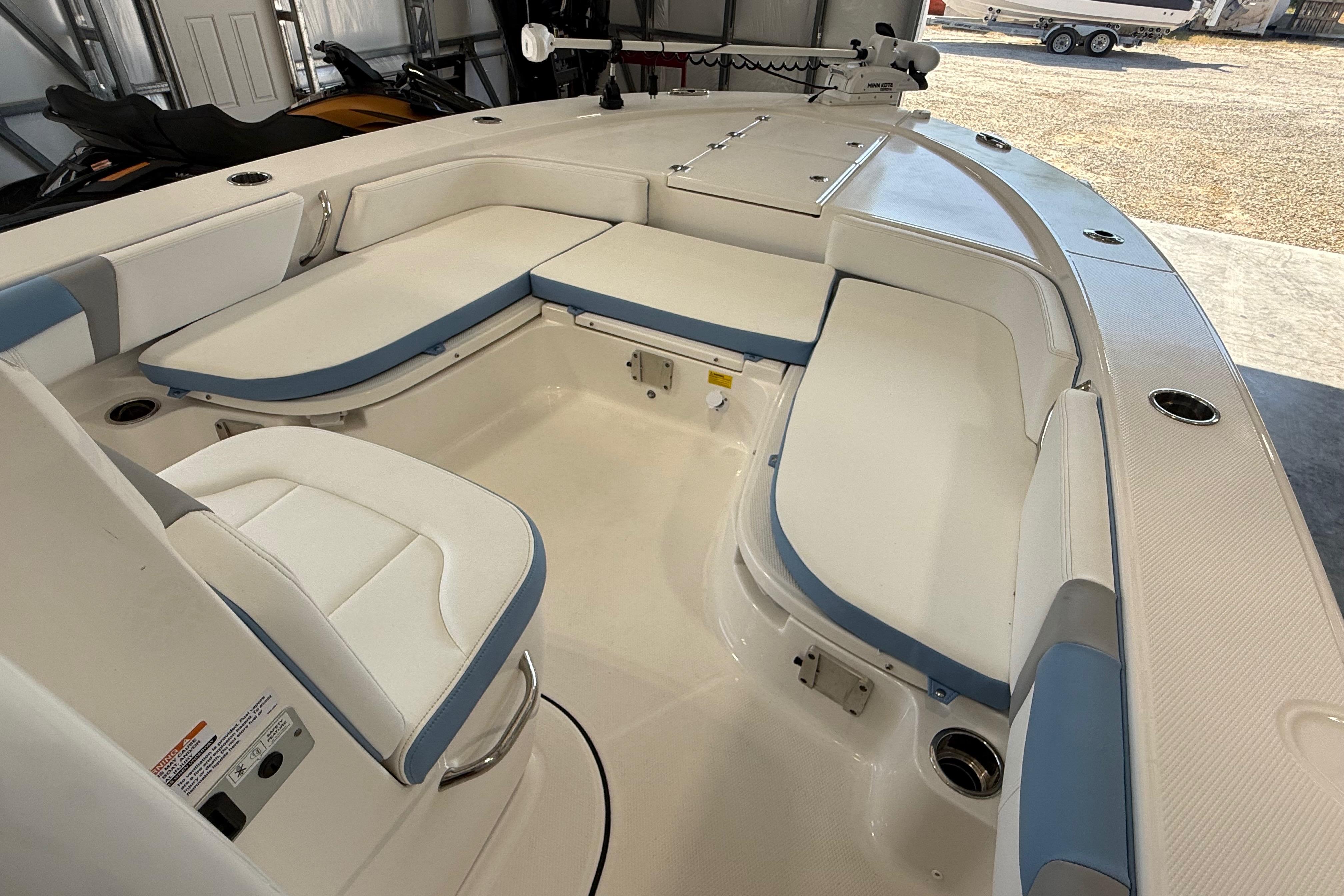 2026 Robalo 246 Cayman boat interior with white and blue seating.