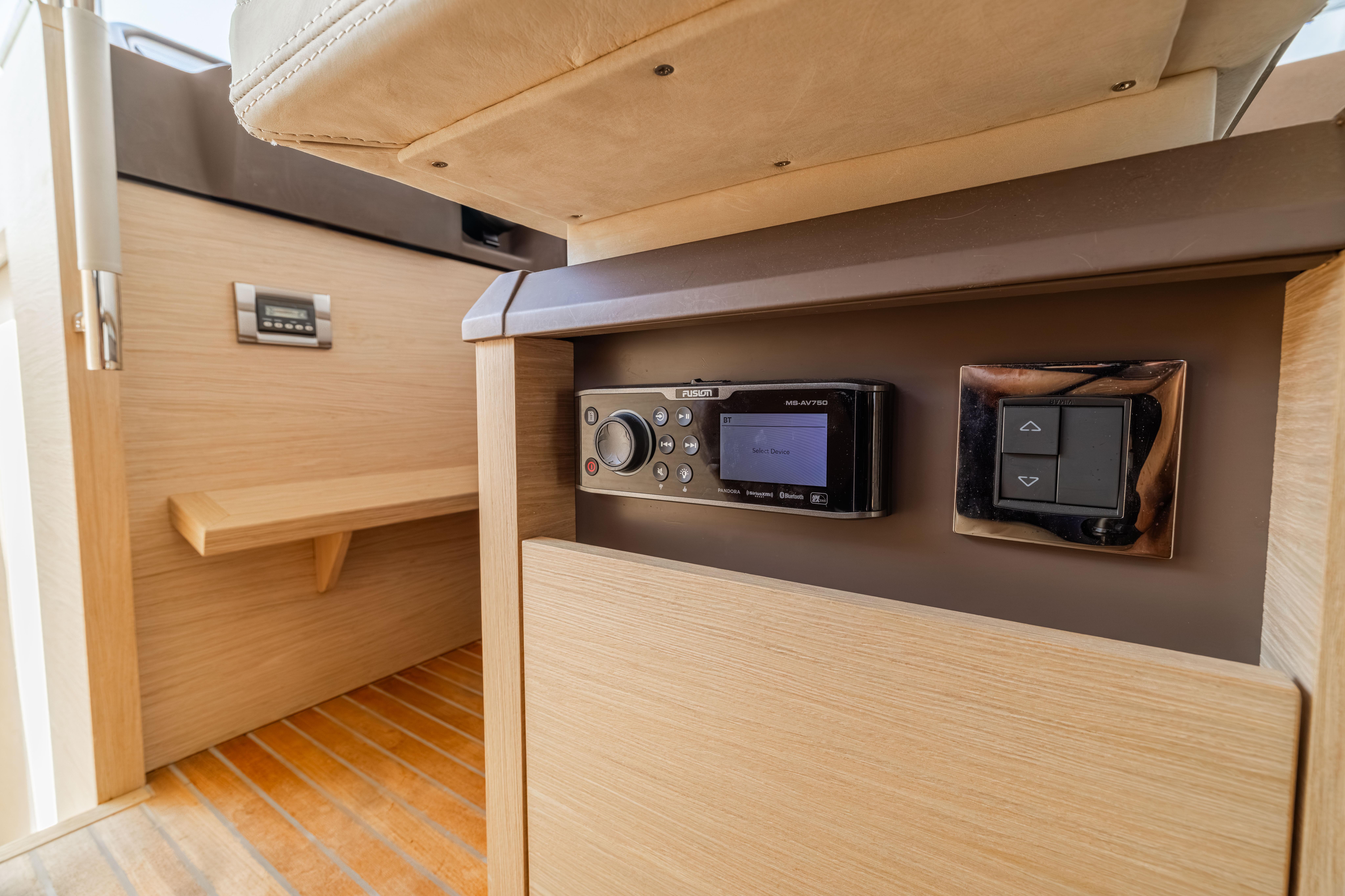 2017 Monte Carlo Yachts MC5 interior control panel with modern design and wood finish.