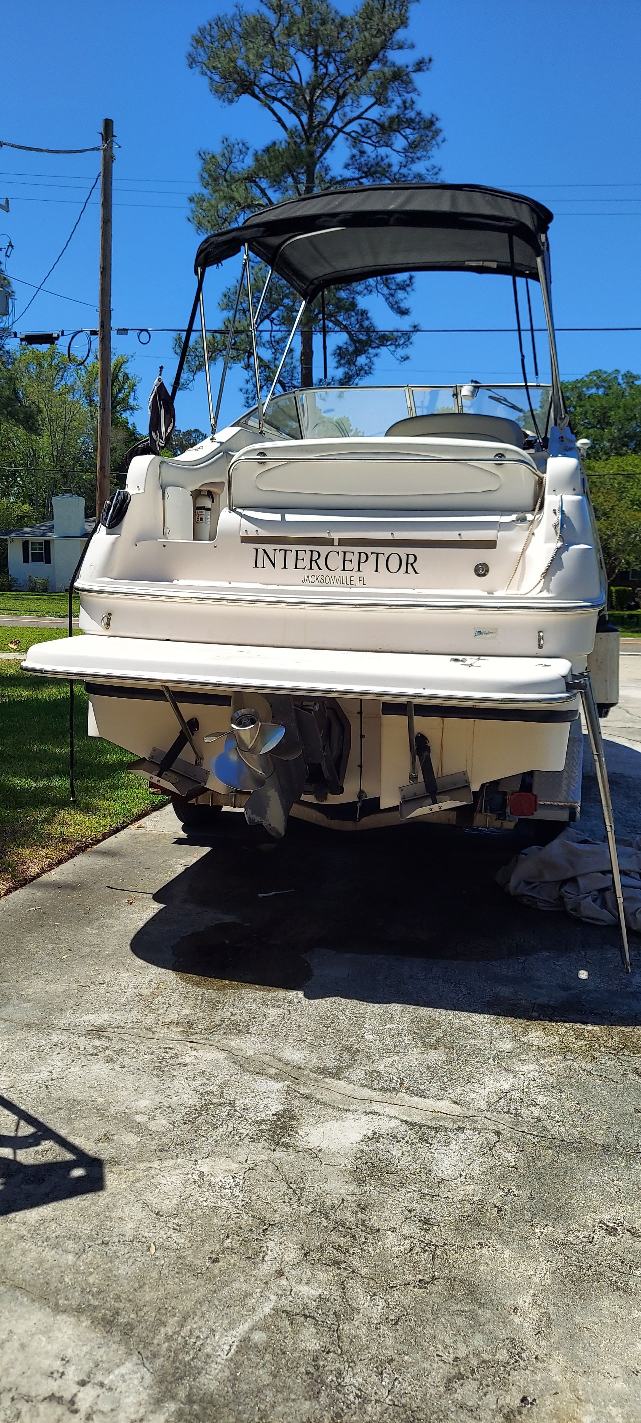 2004 Regal Commodore 2465 boat on a trailer outdoors.