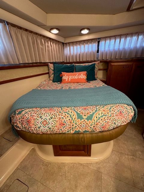 Interior of Carver 3807 yacht with cozy bed and pillows.