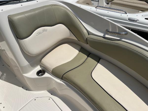 2005 Sea Ray 220 Sundeck boat interior with green and cream seating.
