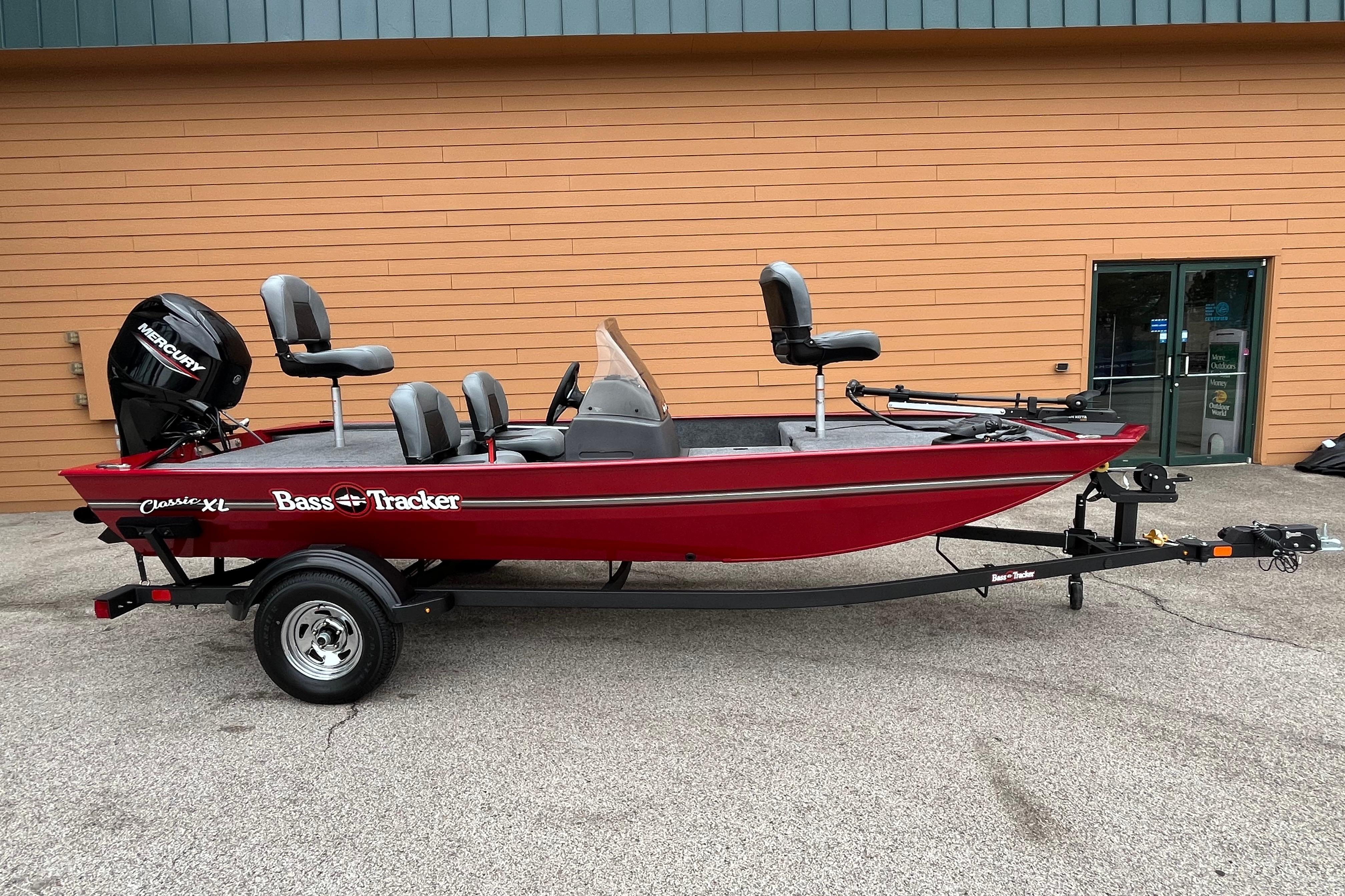 2026 Tracker Bass Tracker Classic XL boat on trailer, red exterior, parked outdoors.