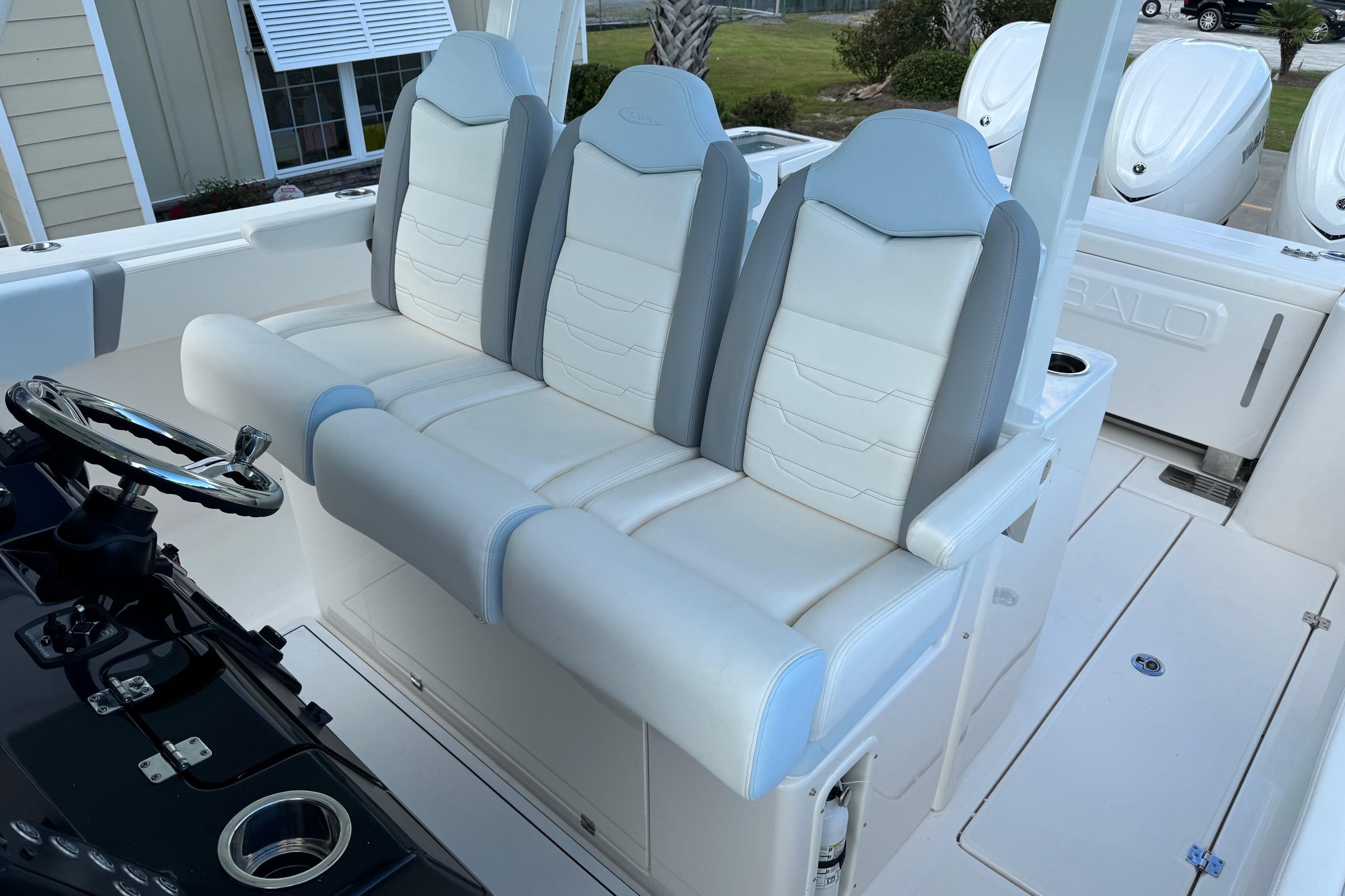 2025 Robalo R360 Center Console boat with sleek white and gray seating.