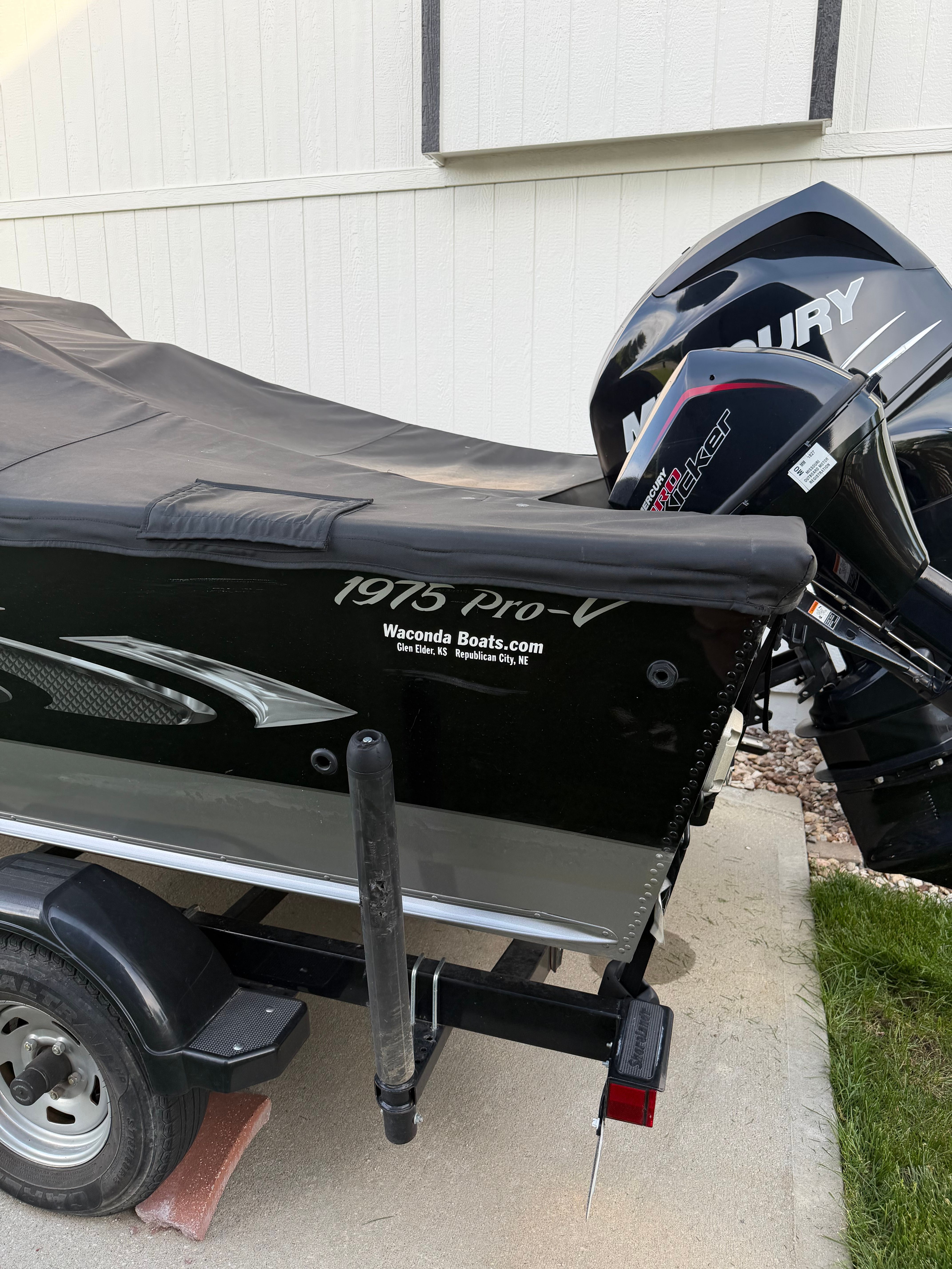 2017 Lund Pro V 1975 boat with Mercury engine, on trailer.